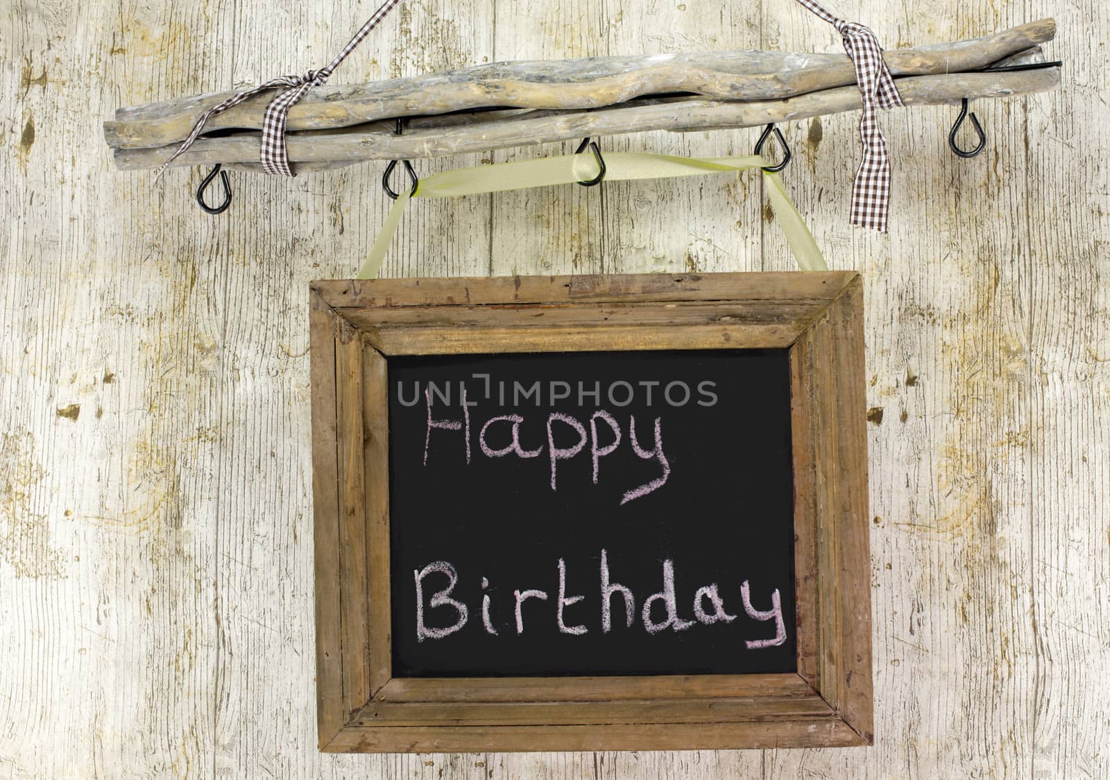 happy birthday board on wooden background