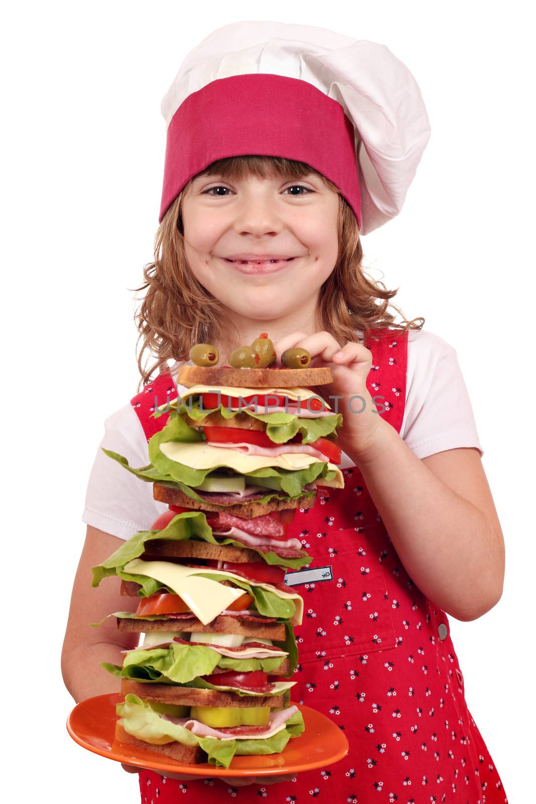 beautiful little girl cook with tall sandwich