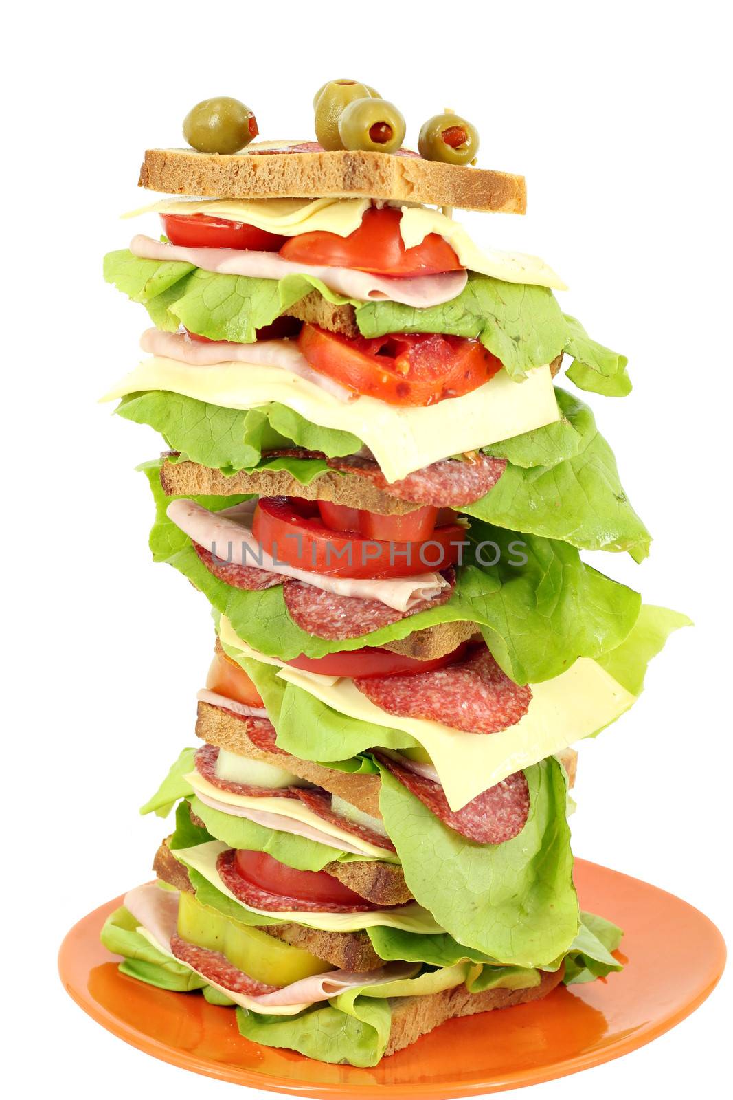 tall sandwich with ham salad and cheese on white background 