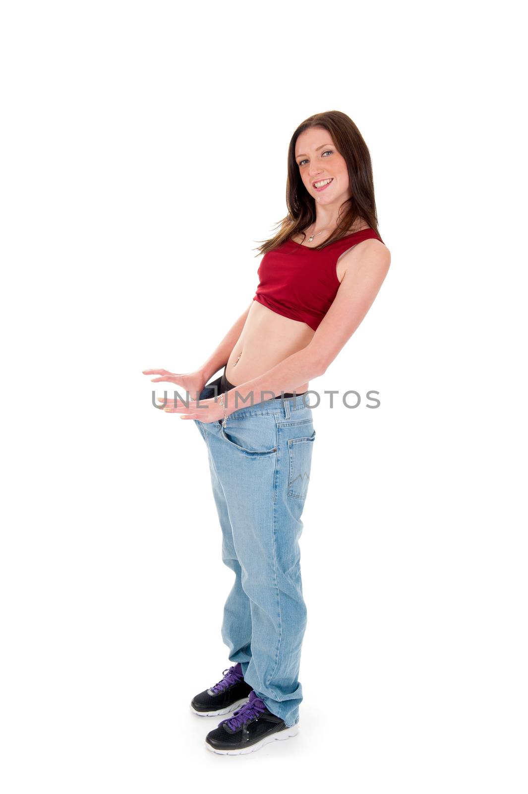 a girl celebrating her success of loosing weight