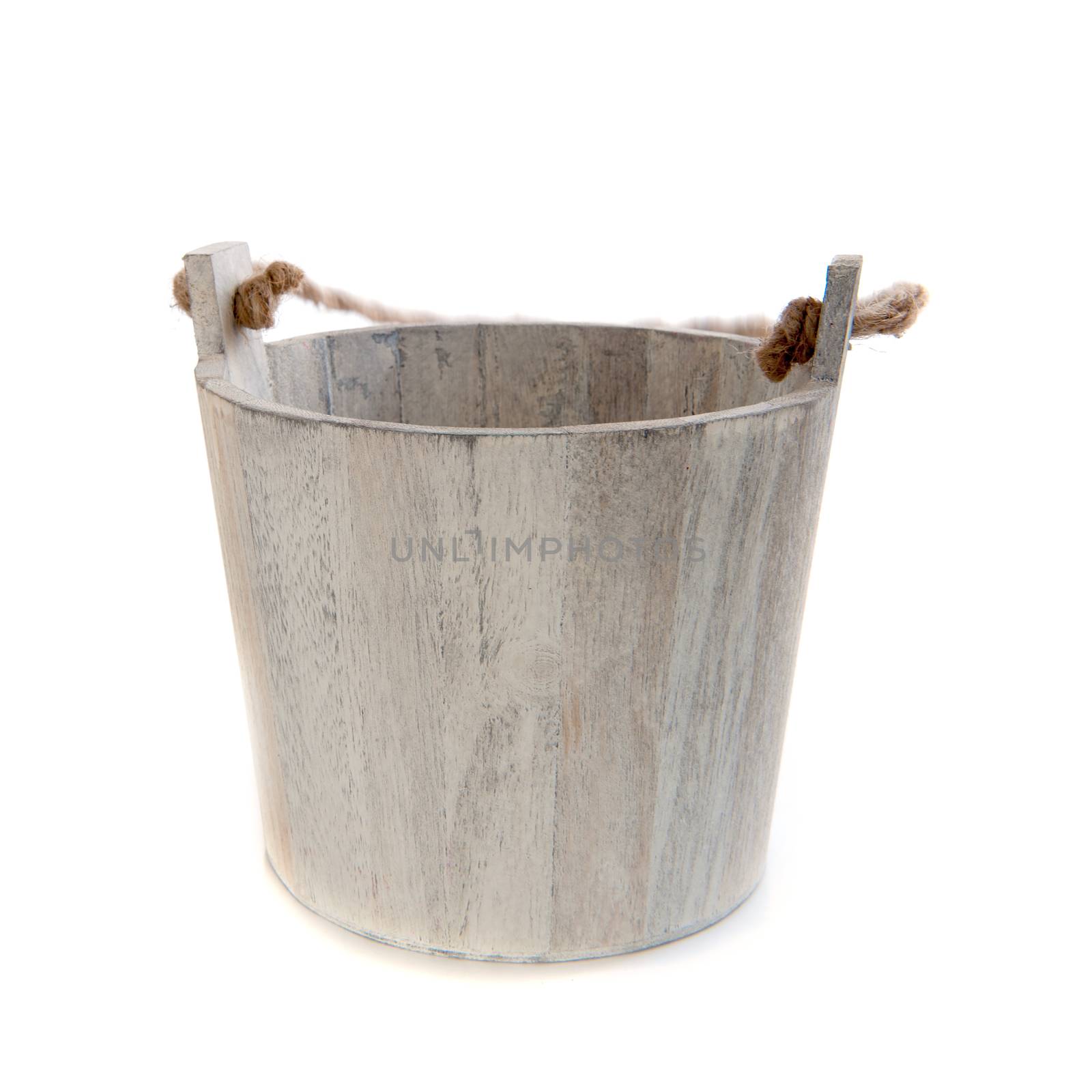 a wooden bucket with a rope on a white background