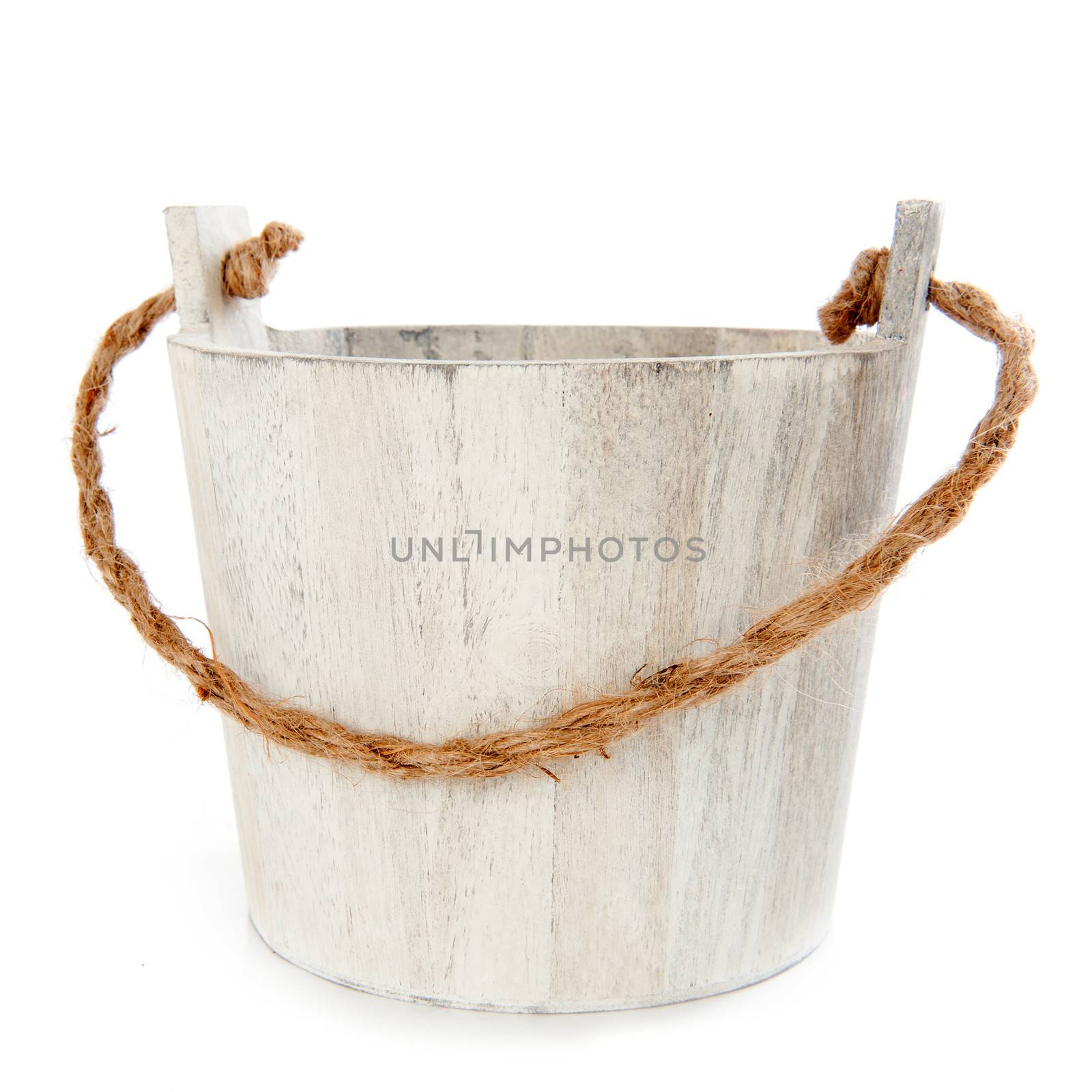 a wooden bucket with a rope on a white background