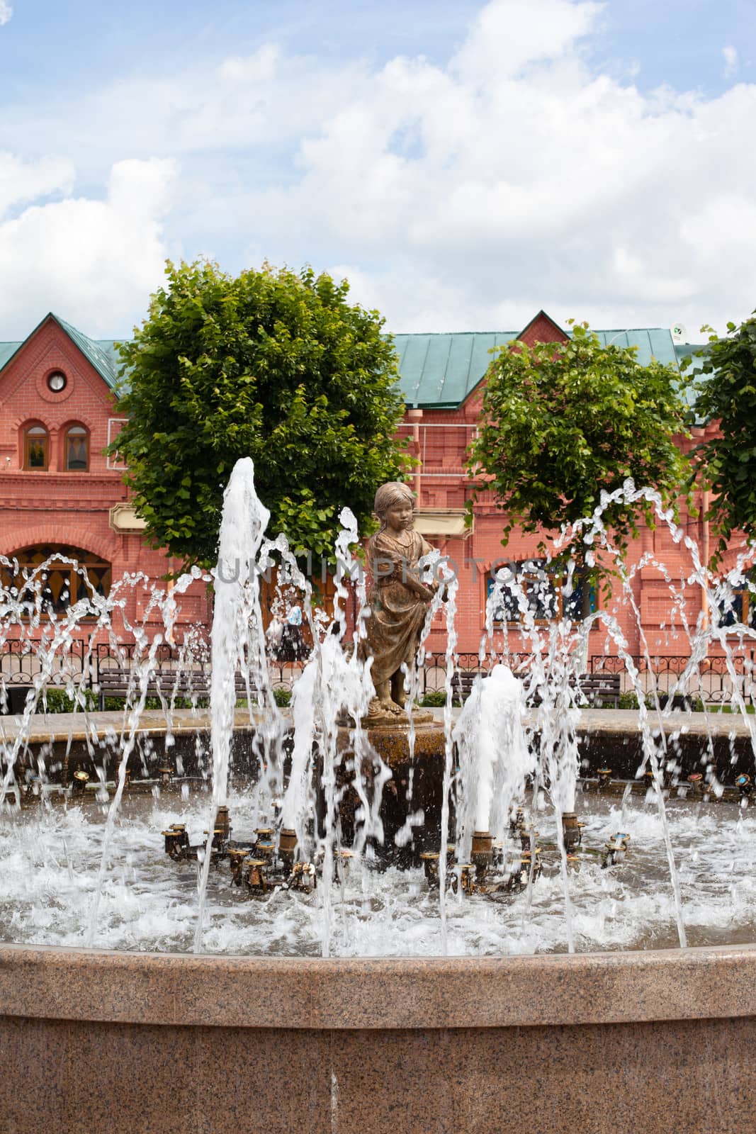 Statue of a little girl in the fountain
