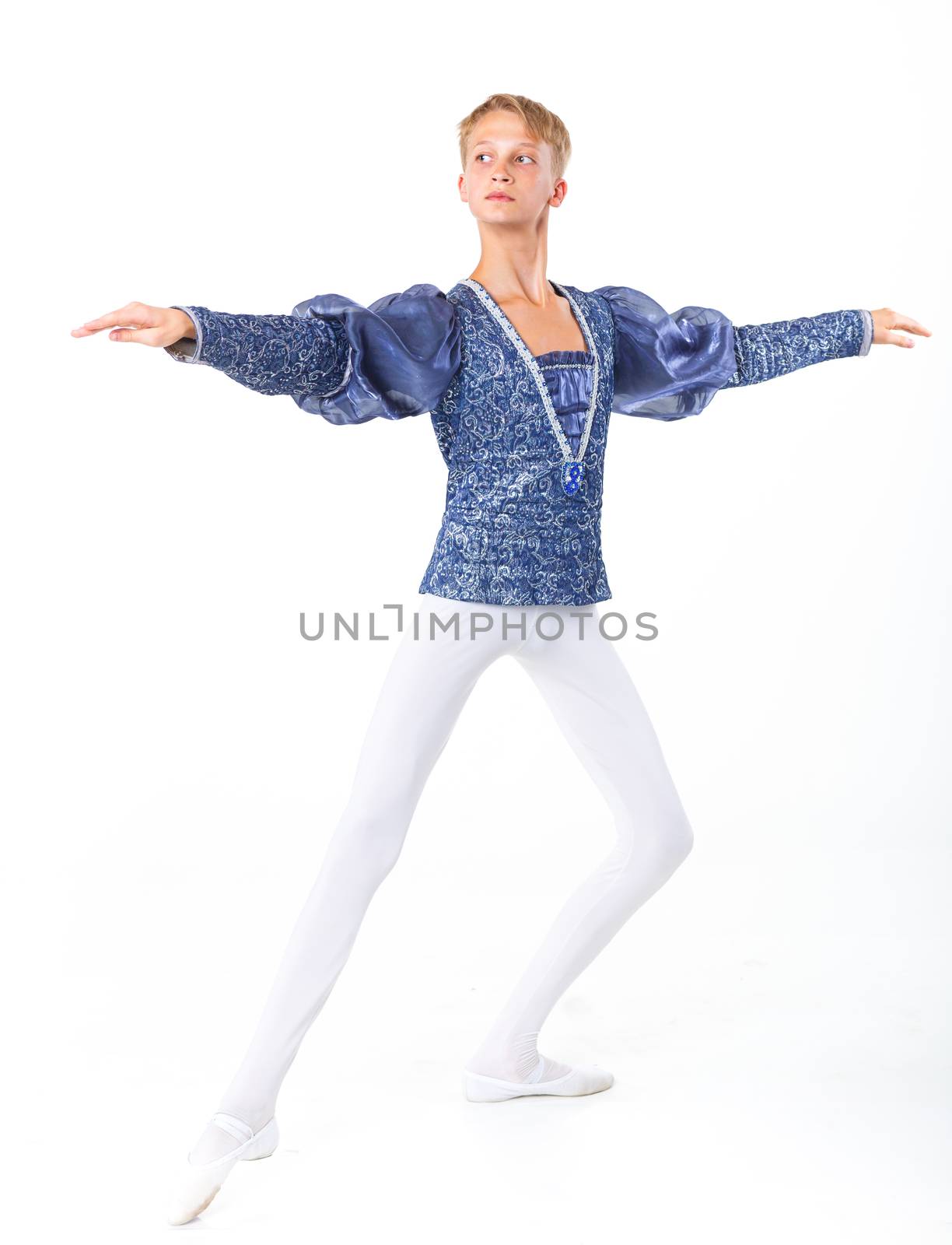 Beautiful young male ballet dancer standing in pose on a white background