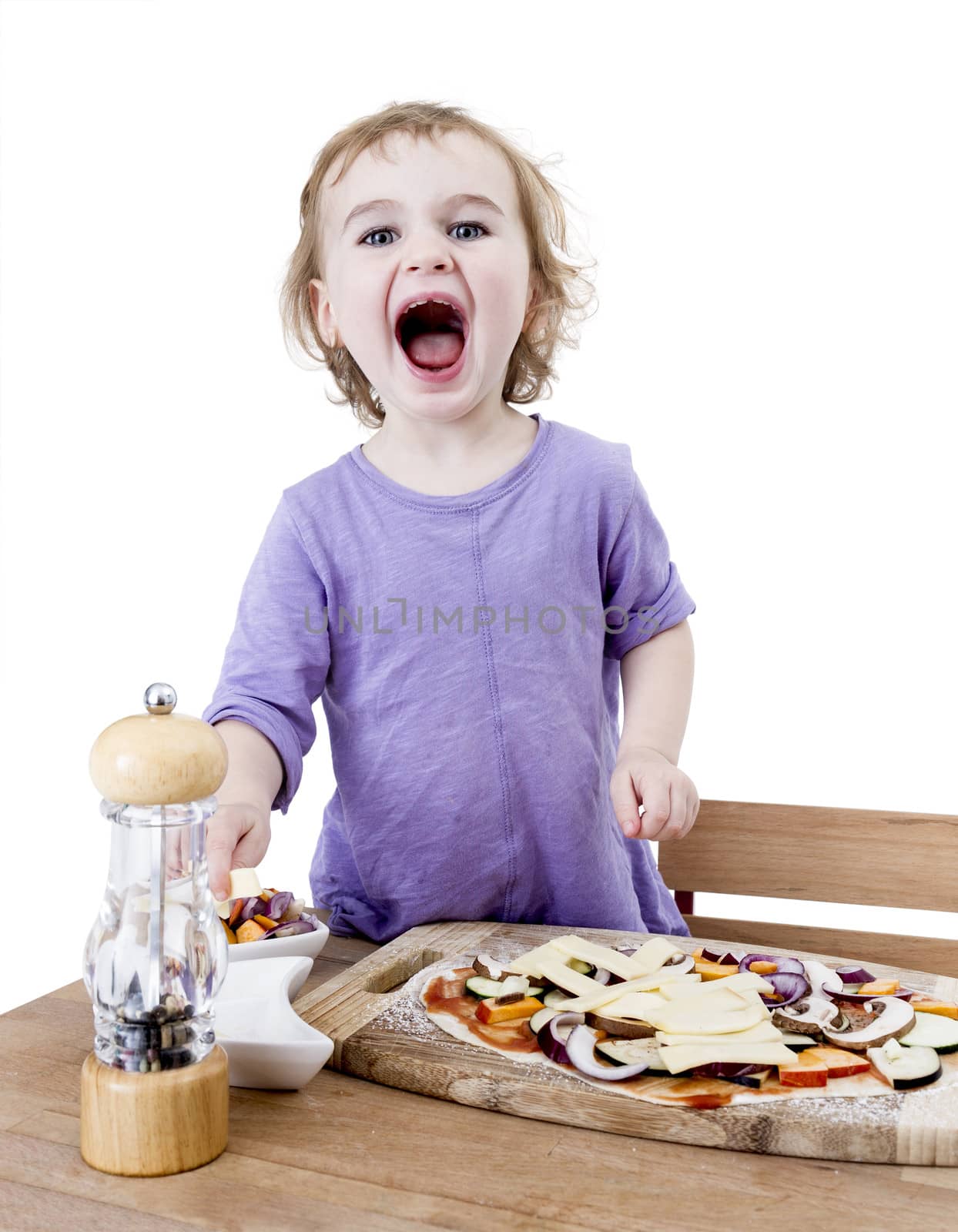 screaming child making fresh pizza. studio shot isolated in white background