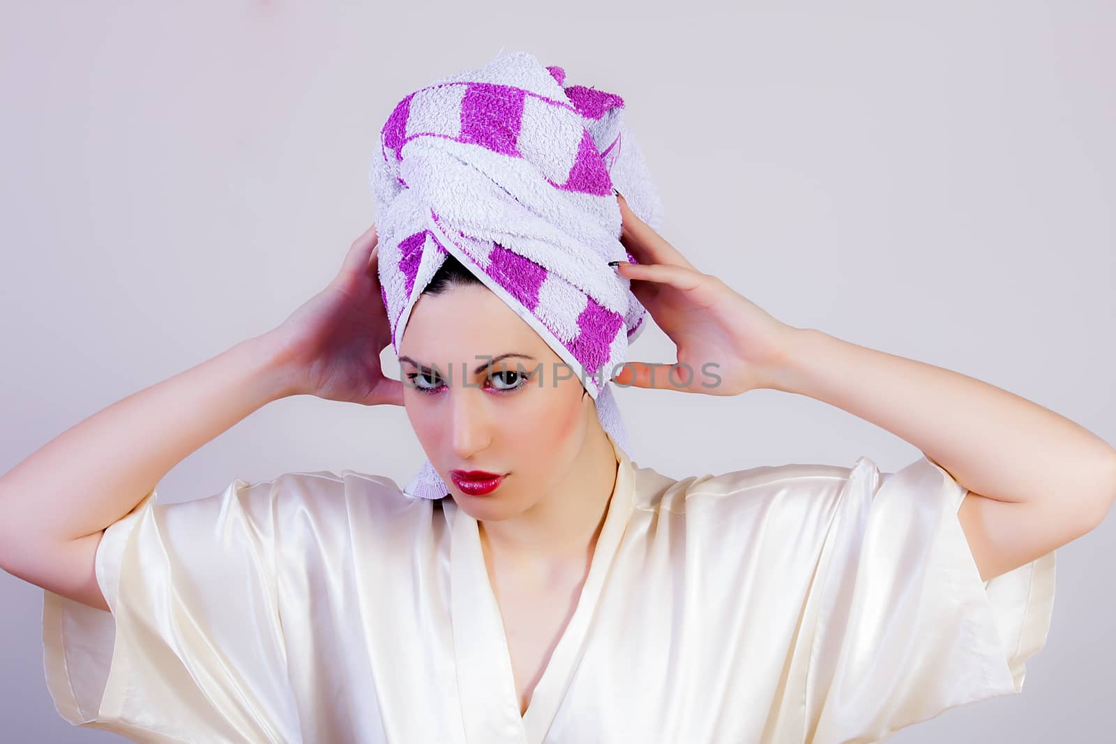 portrait of attractive woman with towel on her head