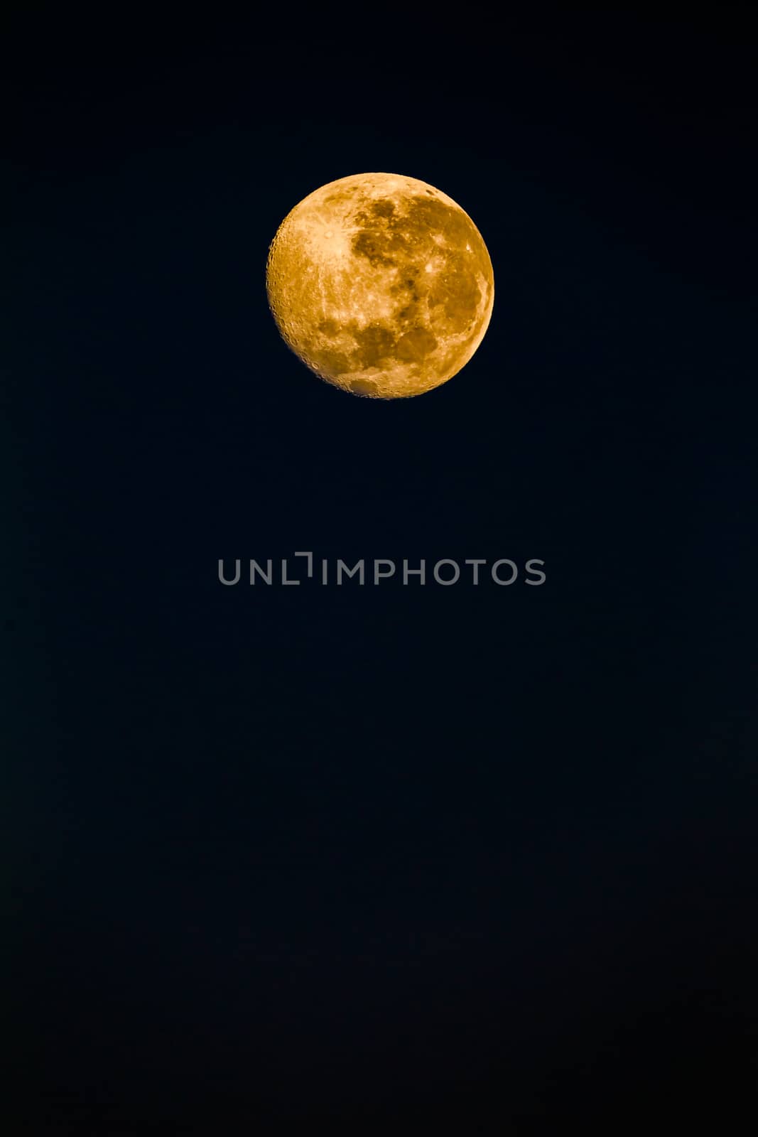 Full moon reflecting color in detail