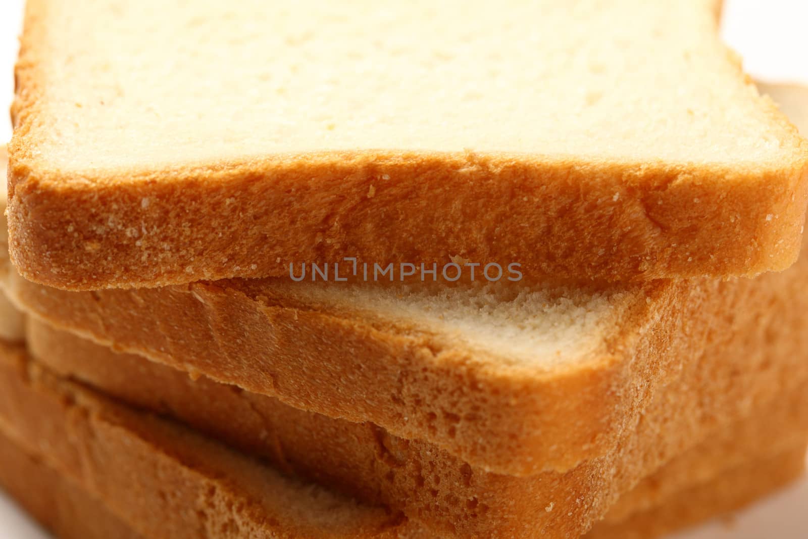 Bread slices on white background by Garsya
