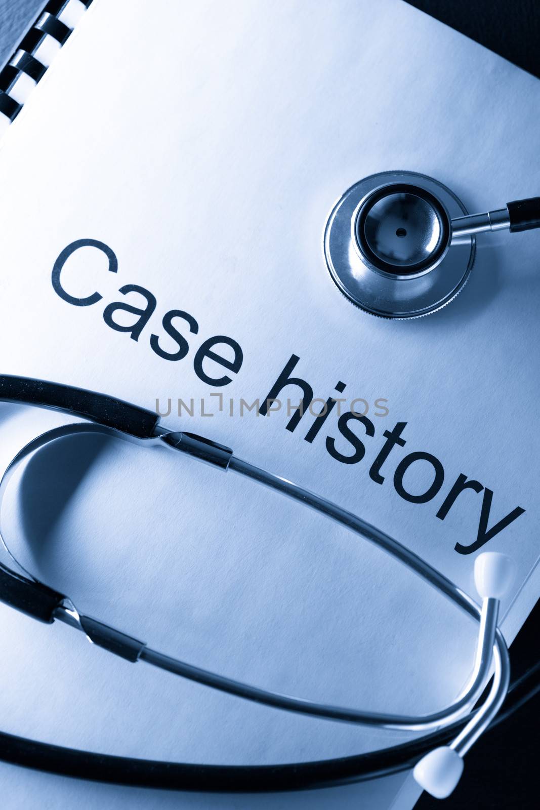 Case history and stethoscope on black by Garsya