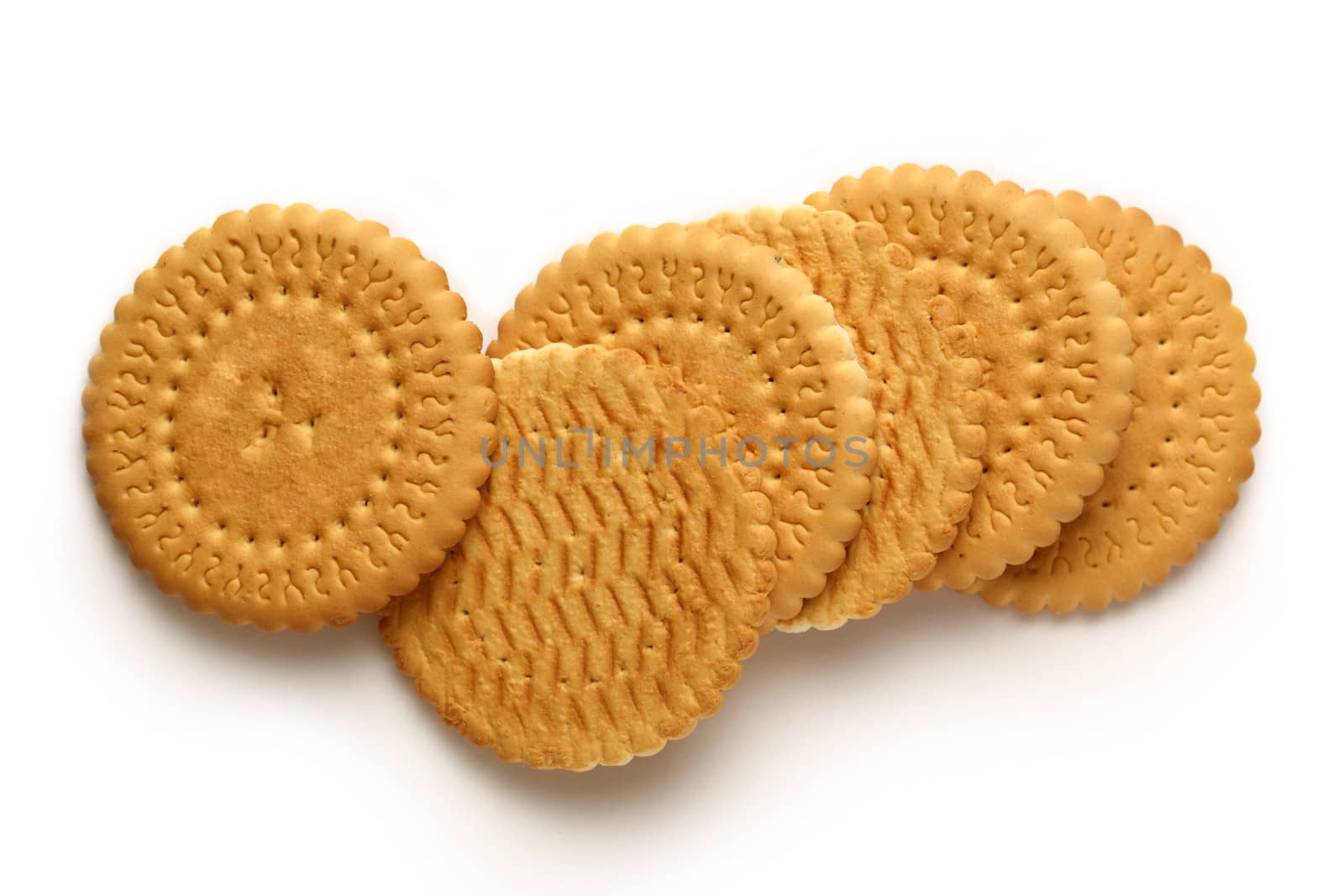 Round biscuits on white background by Garsya
