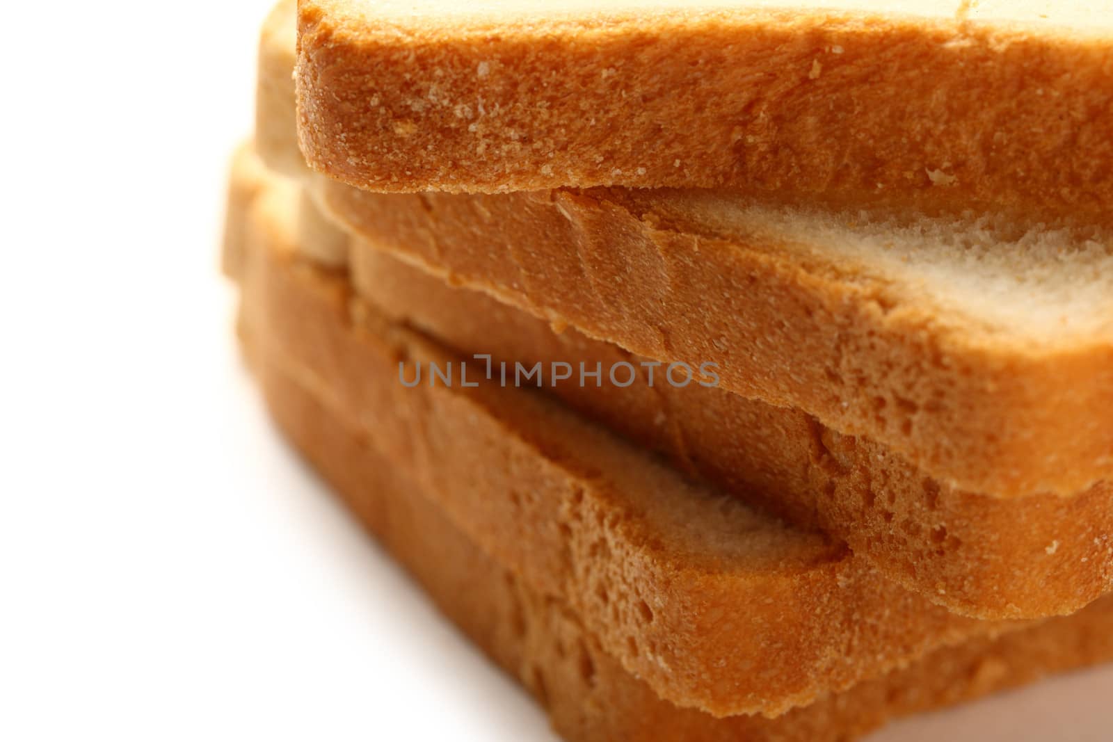 Bread slices on white background by Garsya