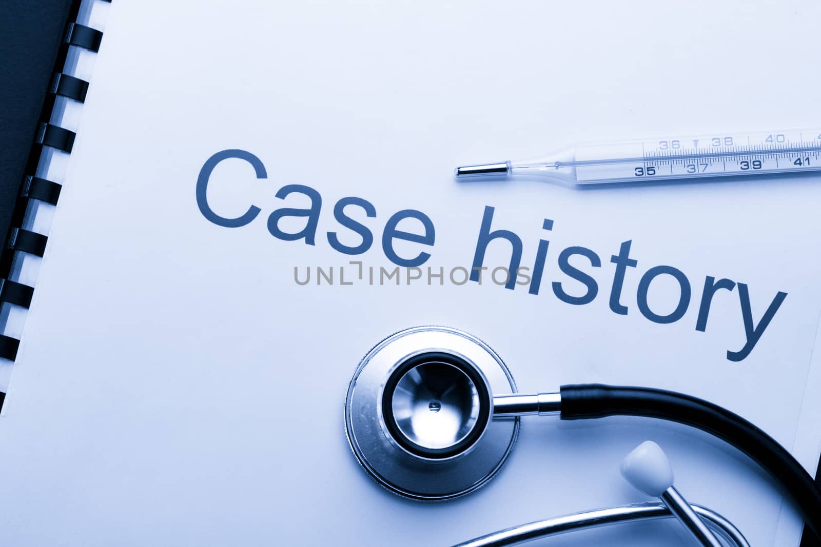 Case history, stethoscope and thermometer on black by Garsya