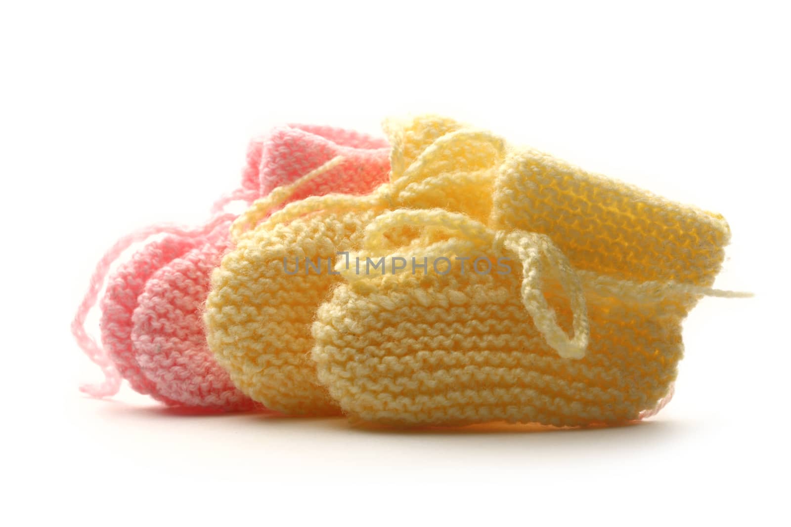 Baby bootees on white background