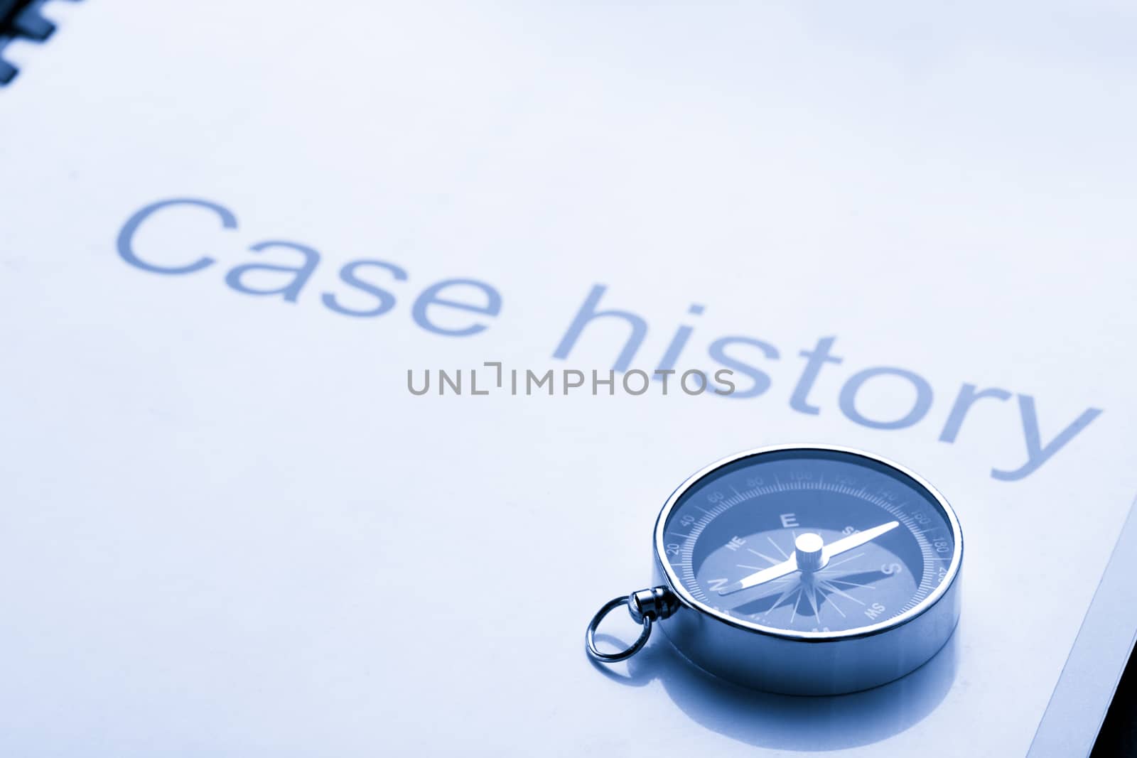 Case history and compass on black
