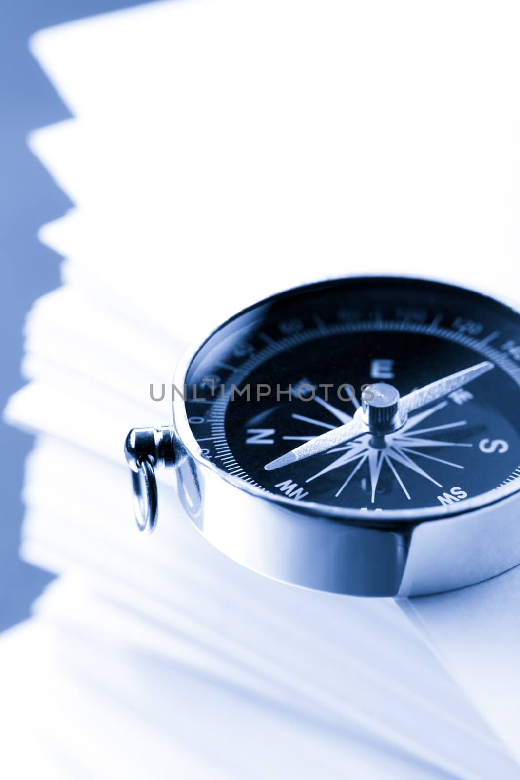 Stack of white cards and compass