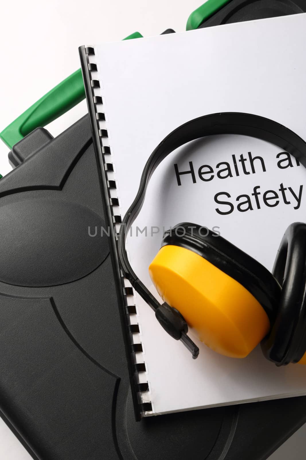 Black toolbox with earphones on white background