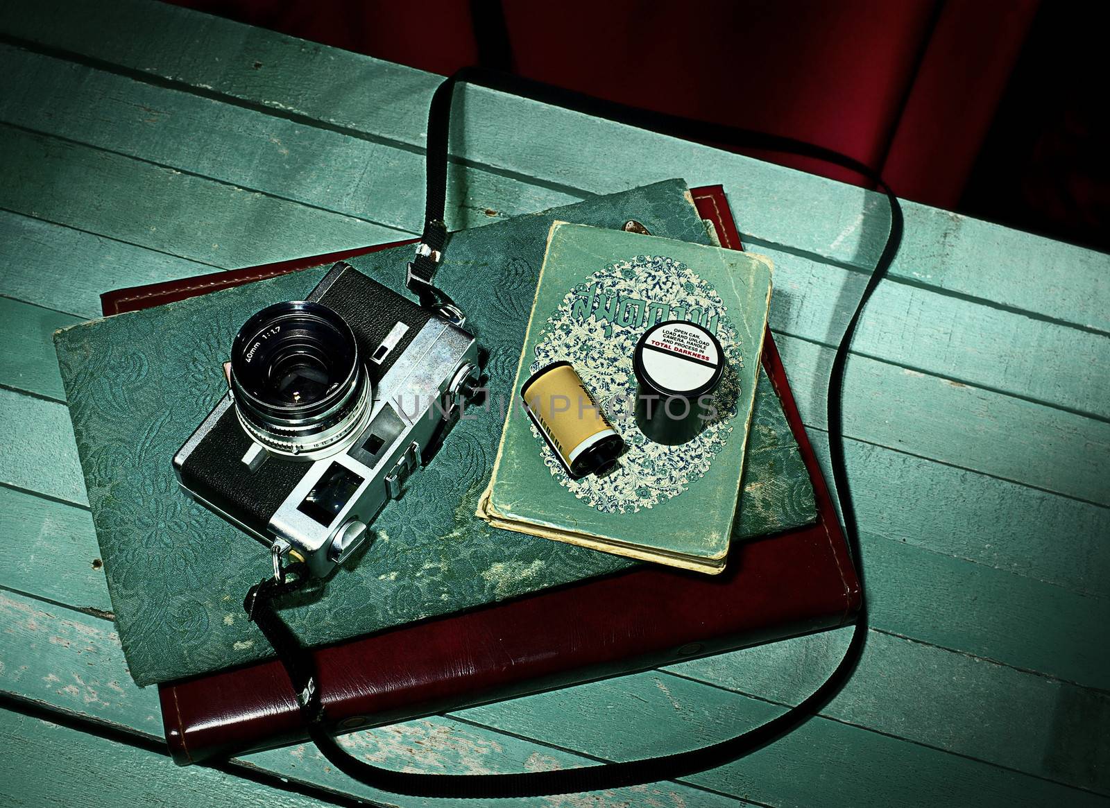 Vintage camera with old photo album, Still life