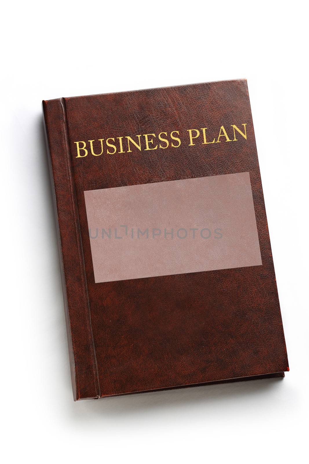 Business plan book on white by Garsya