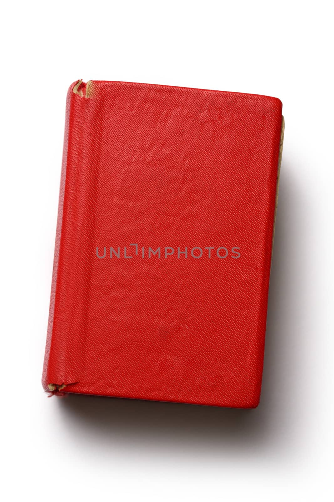 Old red book on white background
