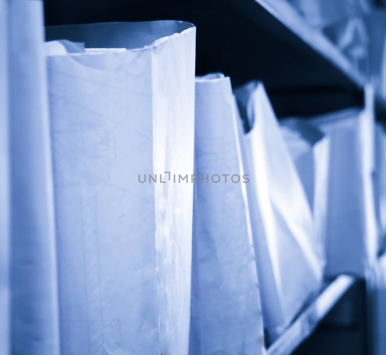 Paper documents stacked in archive