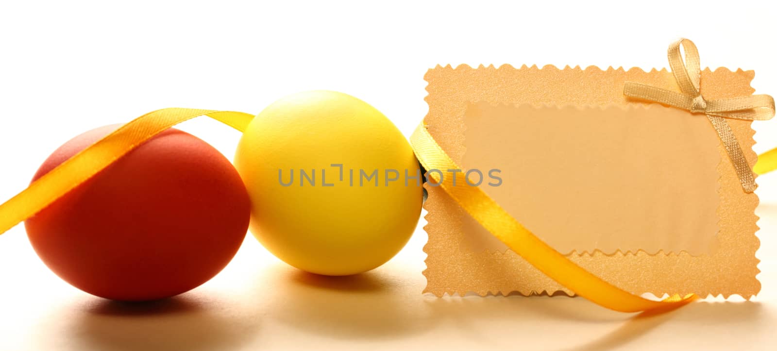 Easter eggs with yellow ribbon and card