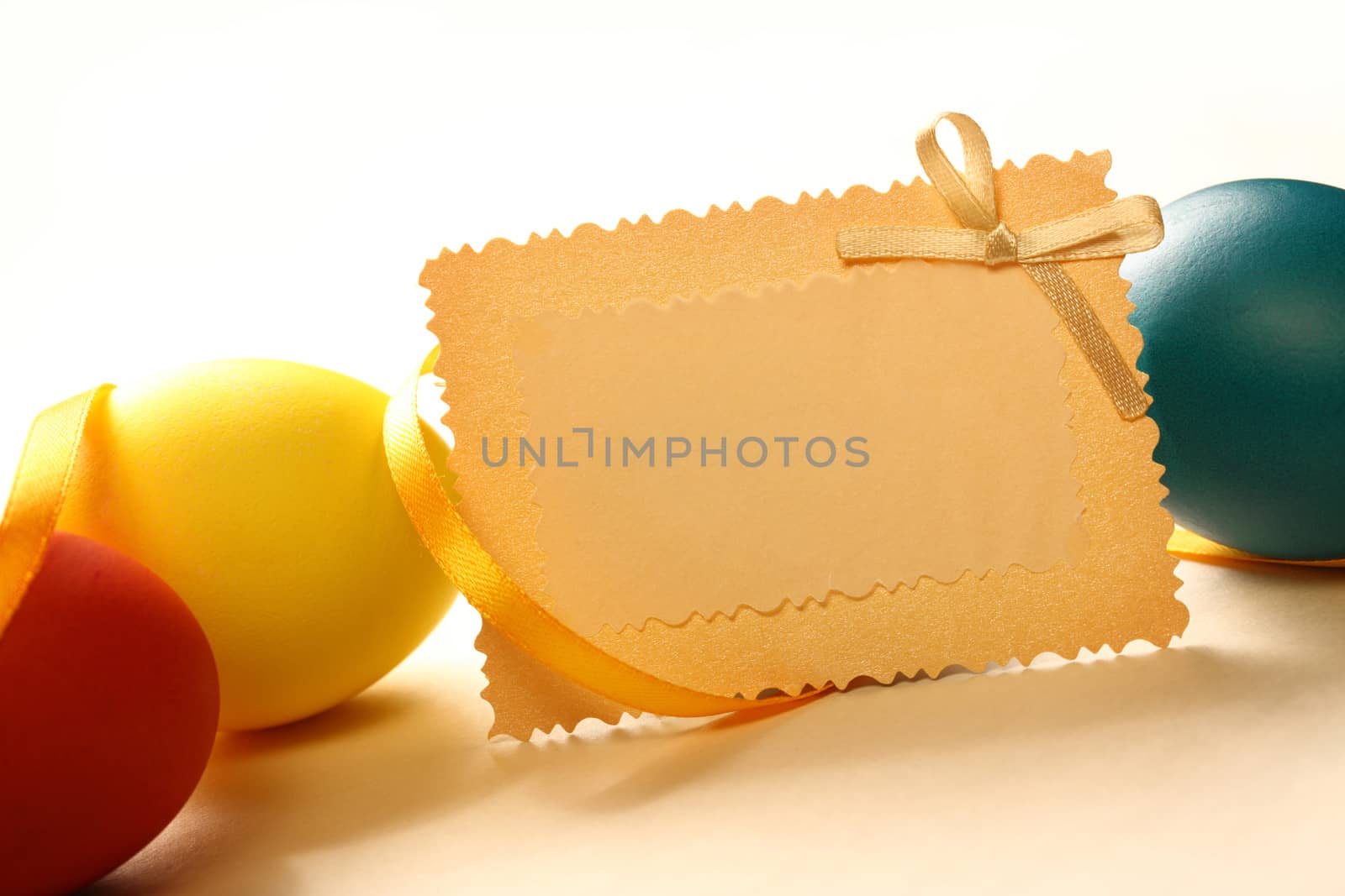 Easter eggs with yellow ribbon and card