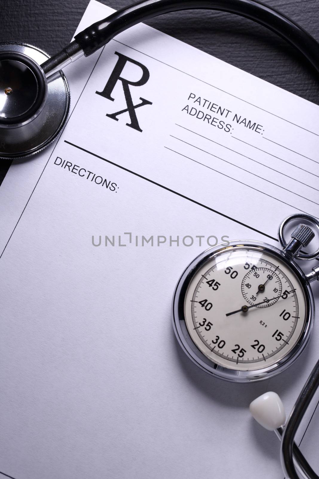 Stethoscope, stopwatch and patient list on black