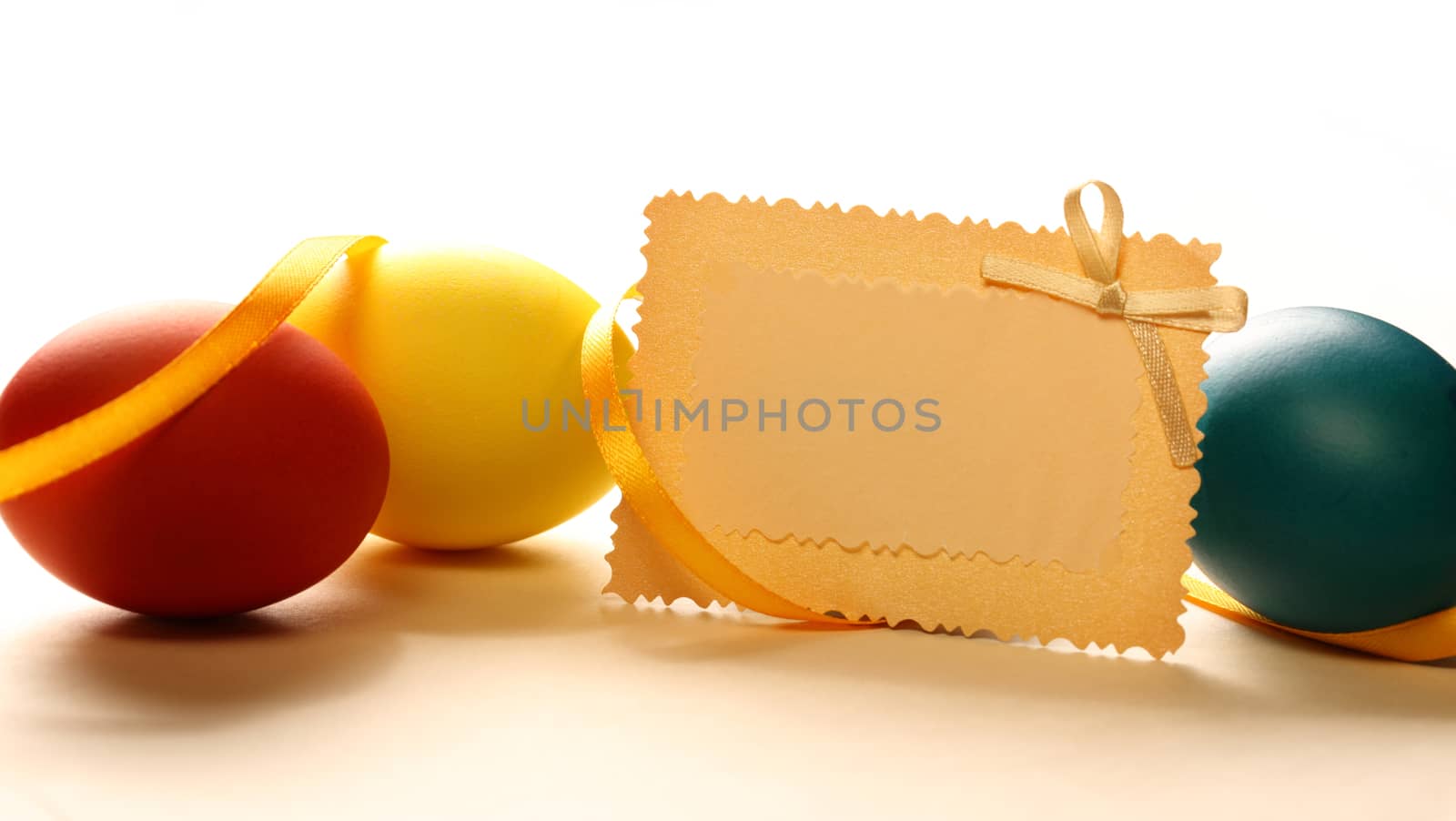 Easter eggs with yellow ribbon and card