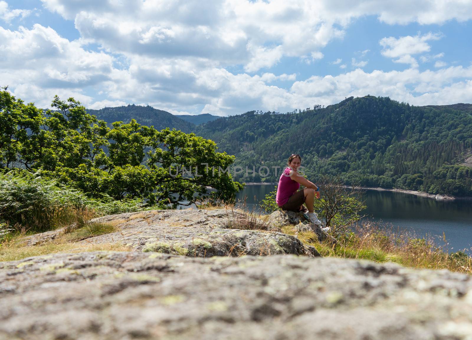 Female hiker overlooking Thirlmere by steheap