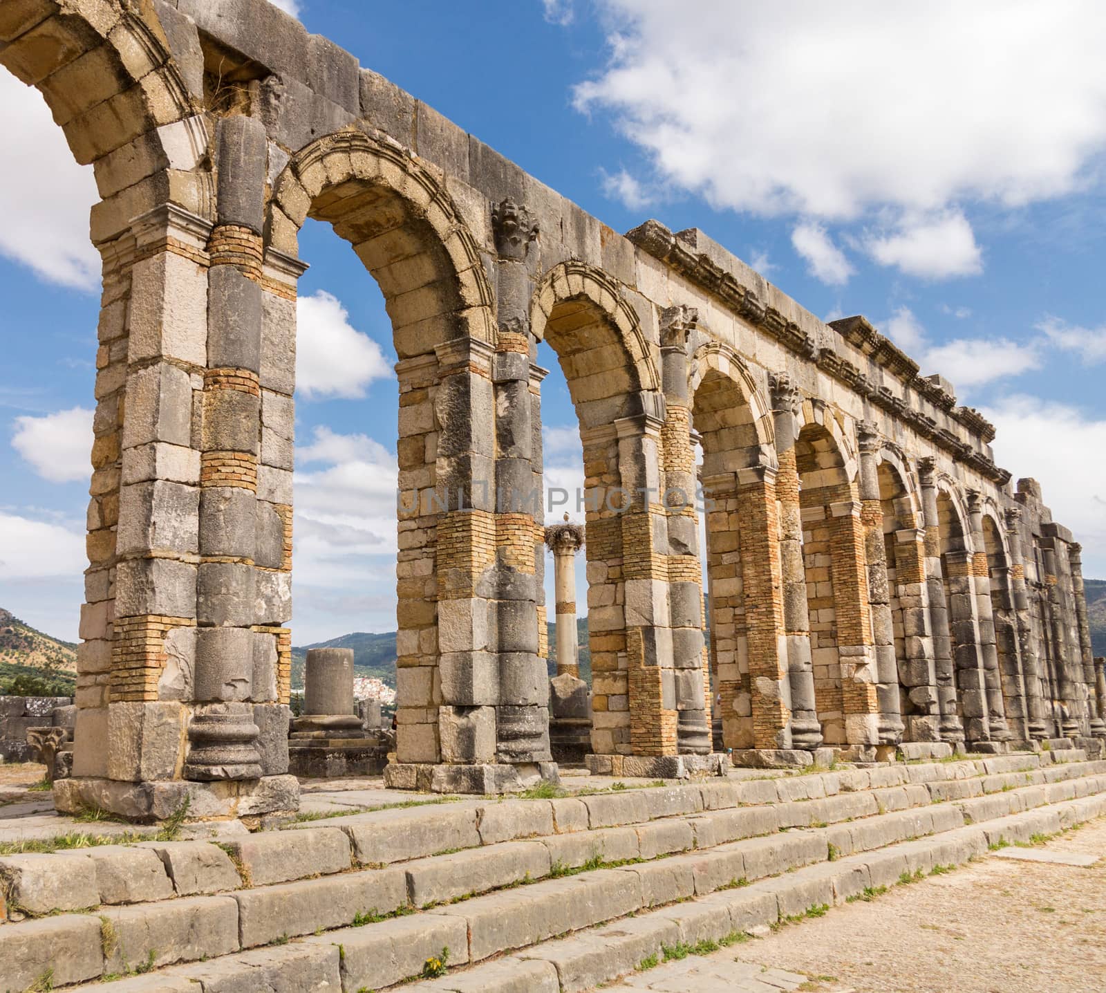 Volubilis is a partly excavated Roman city in Morocco situated near Meknes between Fes and Rabat. Built in a fertile agricultural area, it was developed from the 3rd century BC onwards as a Phoenician Carthaginian settlement
