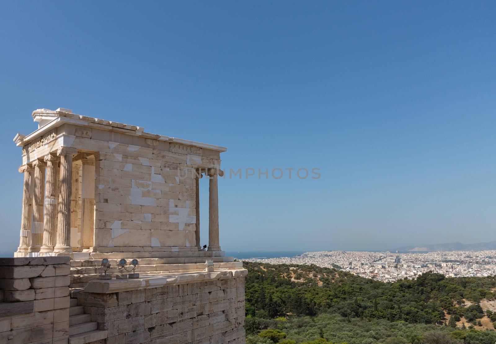 The Temple of Athena Nike is a temple on the Acropolis of Athens. Built between 427 and 424 BC, the temple is the earliest fully Ionic temple with a prominent position on a steep bastion to the right of the entrance, the Propylaea