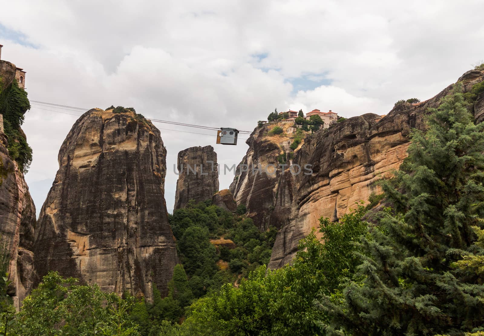 Cable car between monasteries at Meteora meaning middle of the sky, suspended in the air or in the heavens above is one of the largest and most important complexes of Eastern Orthodox monasteries in Greece. The six monasteries are built on natural sandstone rock pillars