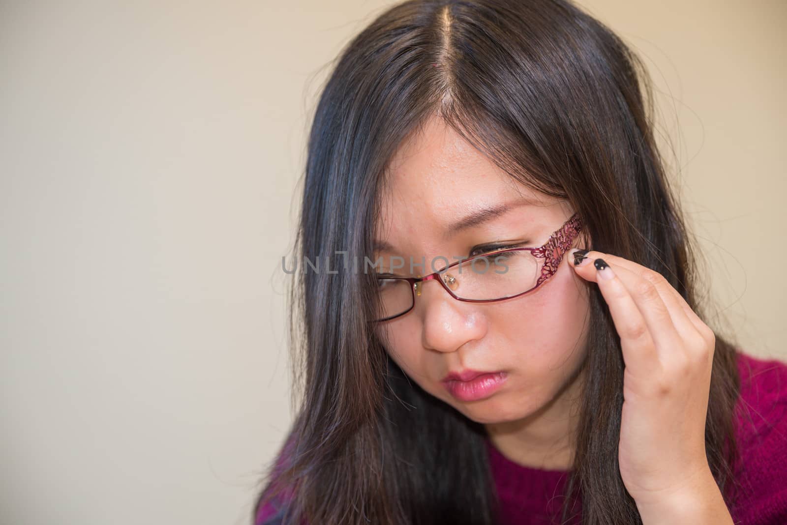 Close portrait of young woman with glasses