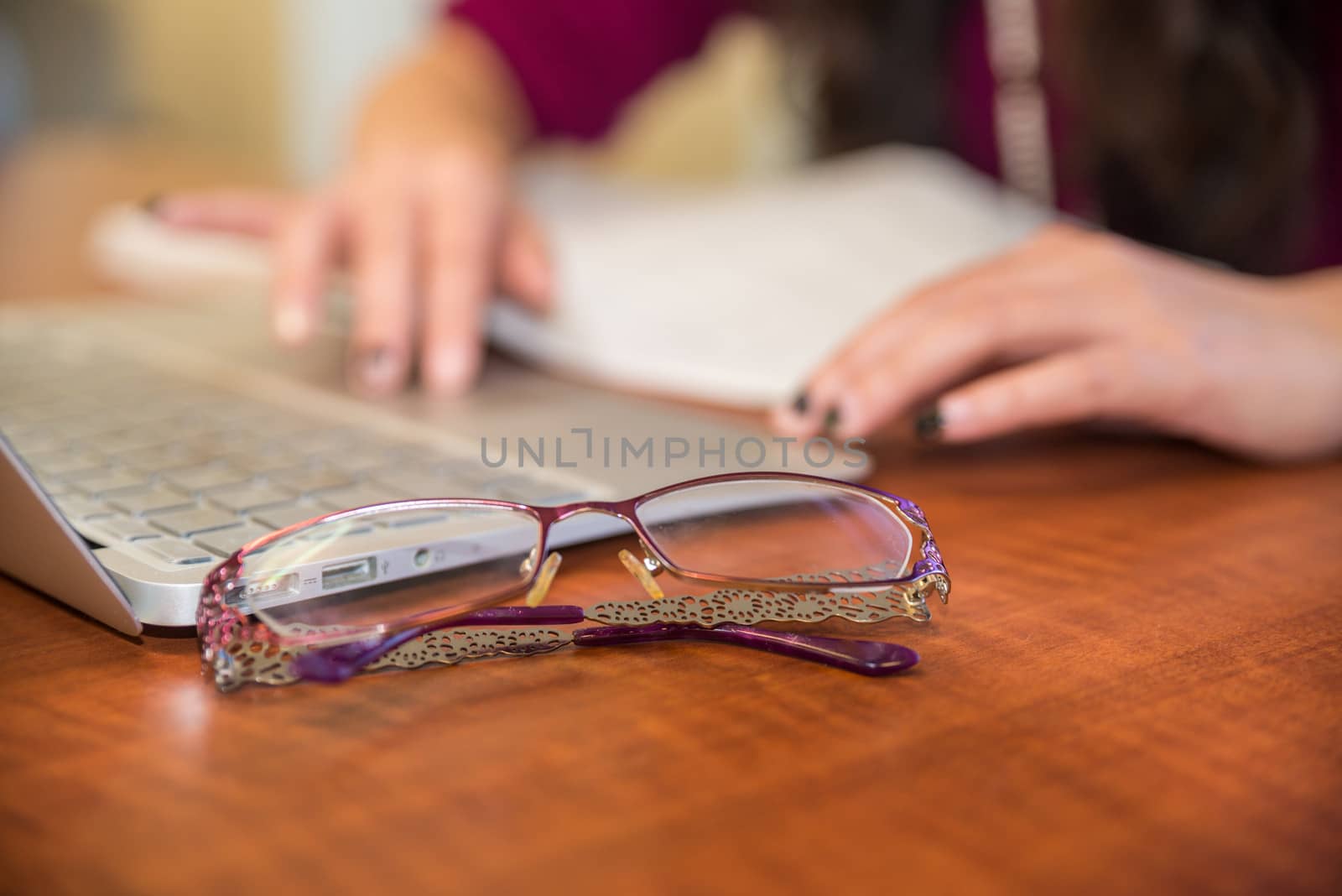 Hands on laptop by IVYPHOTOS