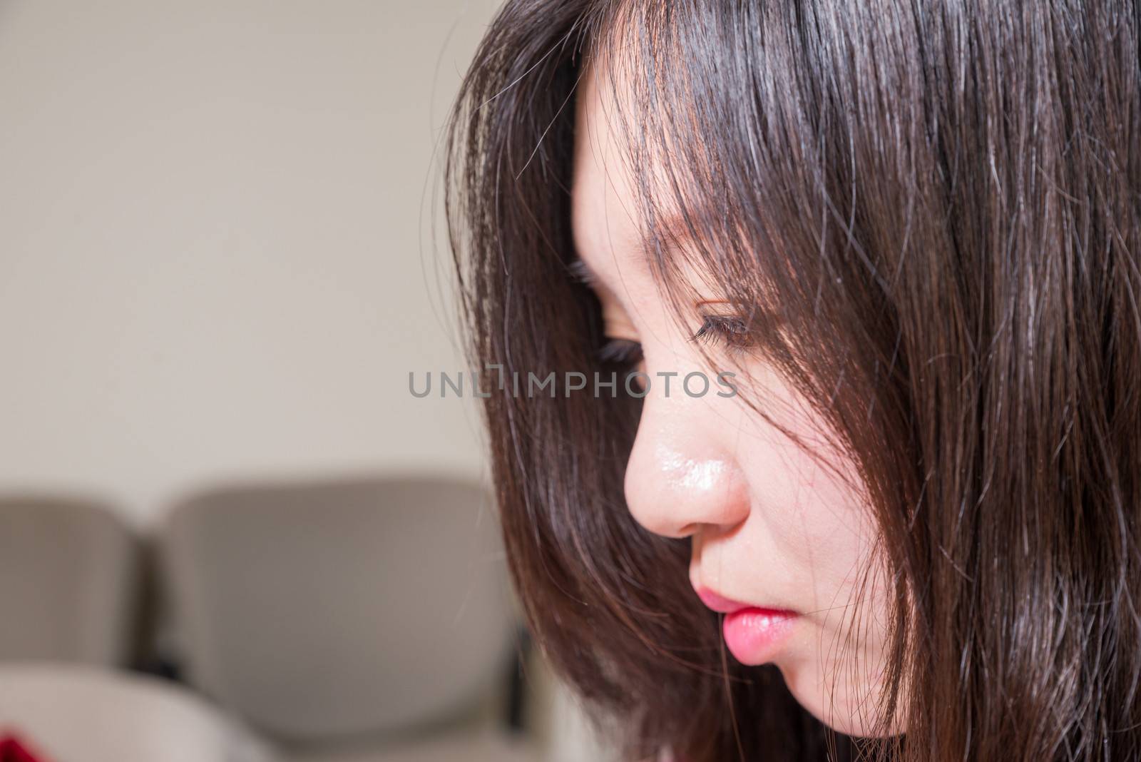 Close portrait of young woman looking depressed