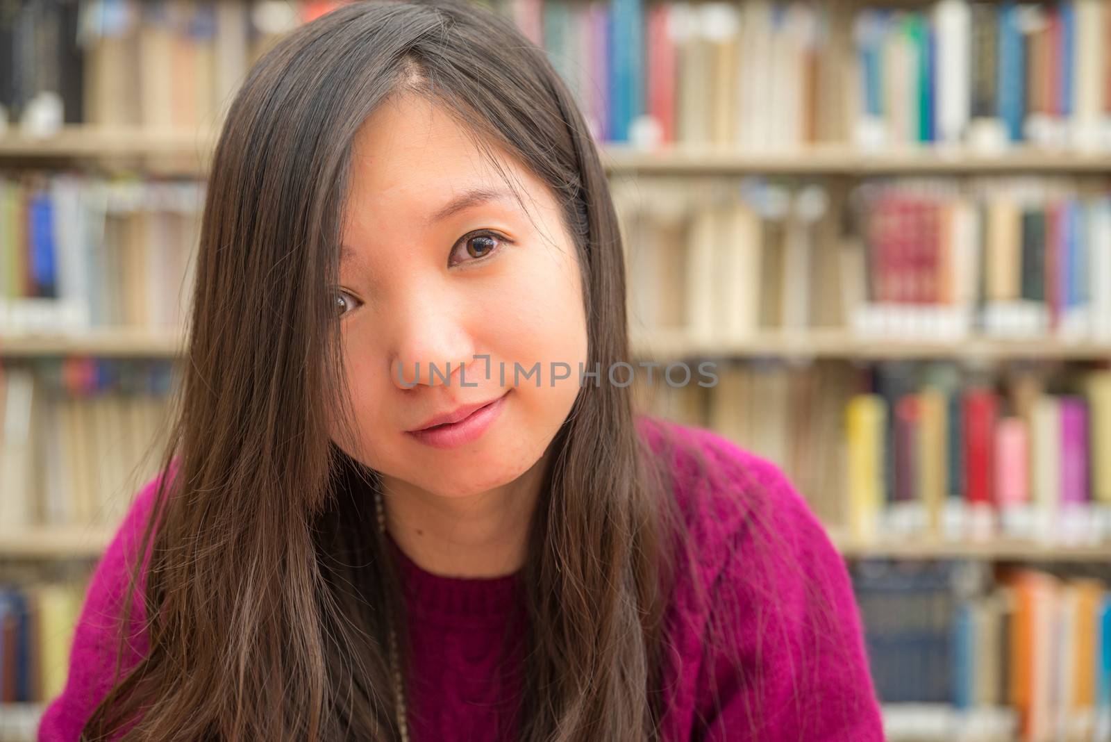Female Portrait in Library by IVYPHOTOS