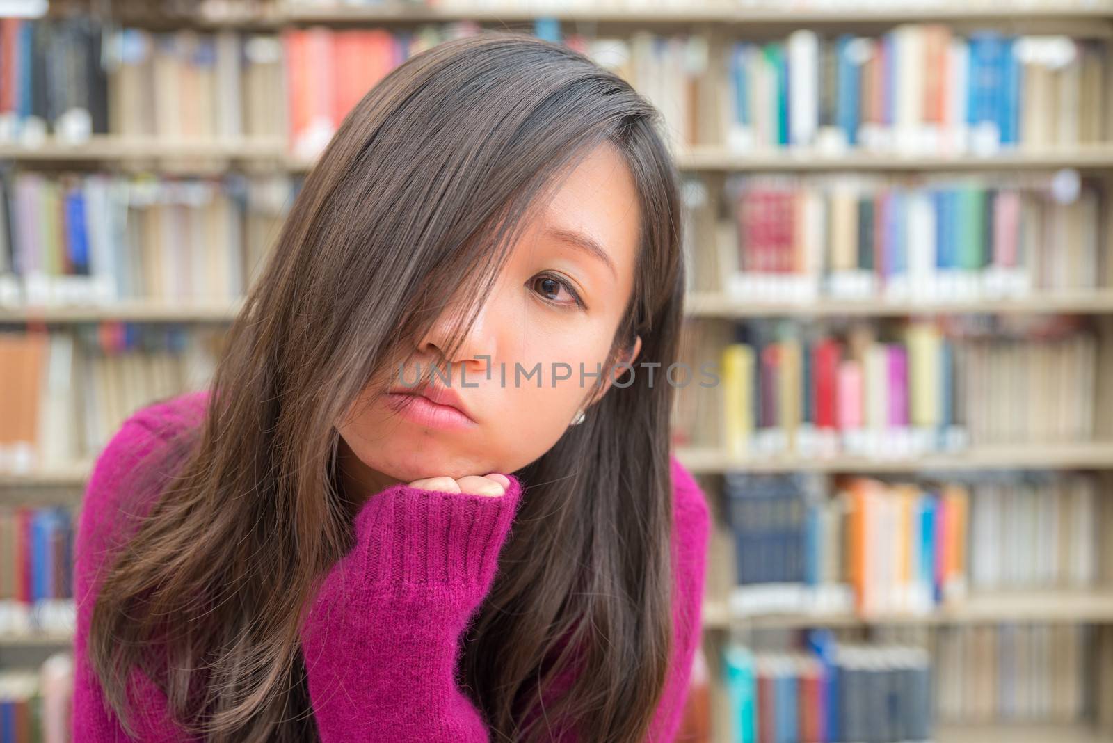 Female Portrait in Library by IVYPHOTOS