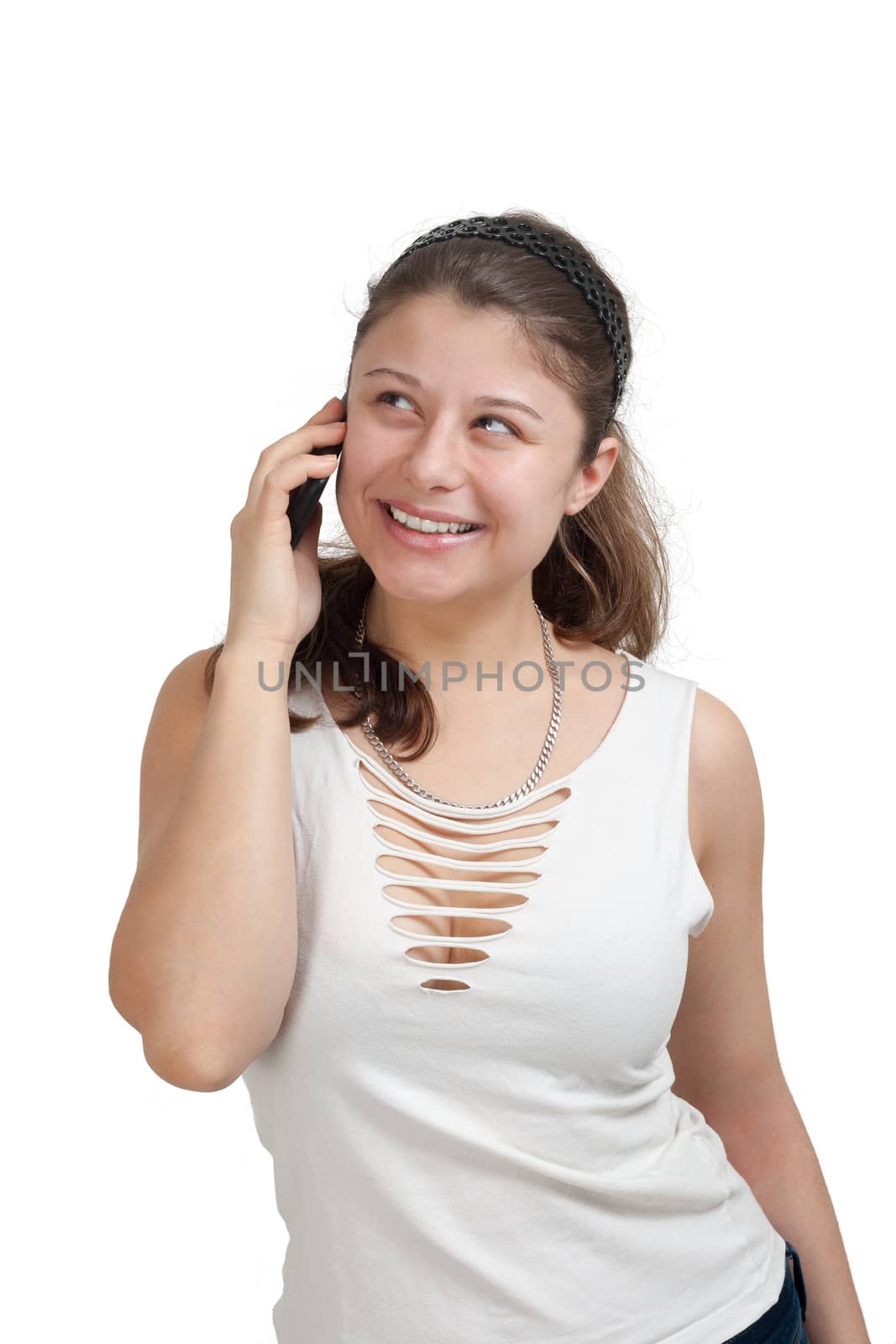 young brunette woman is talking to someone with her smartphone - isolated on white background