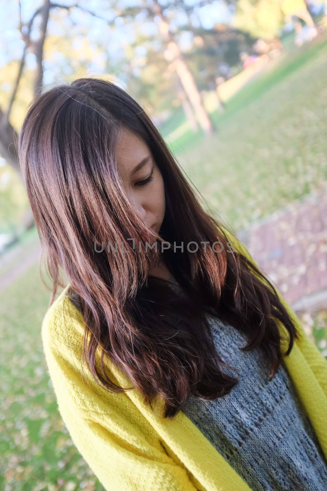 Portrait of young woman with hair covering her face