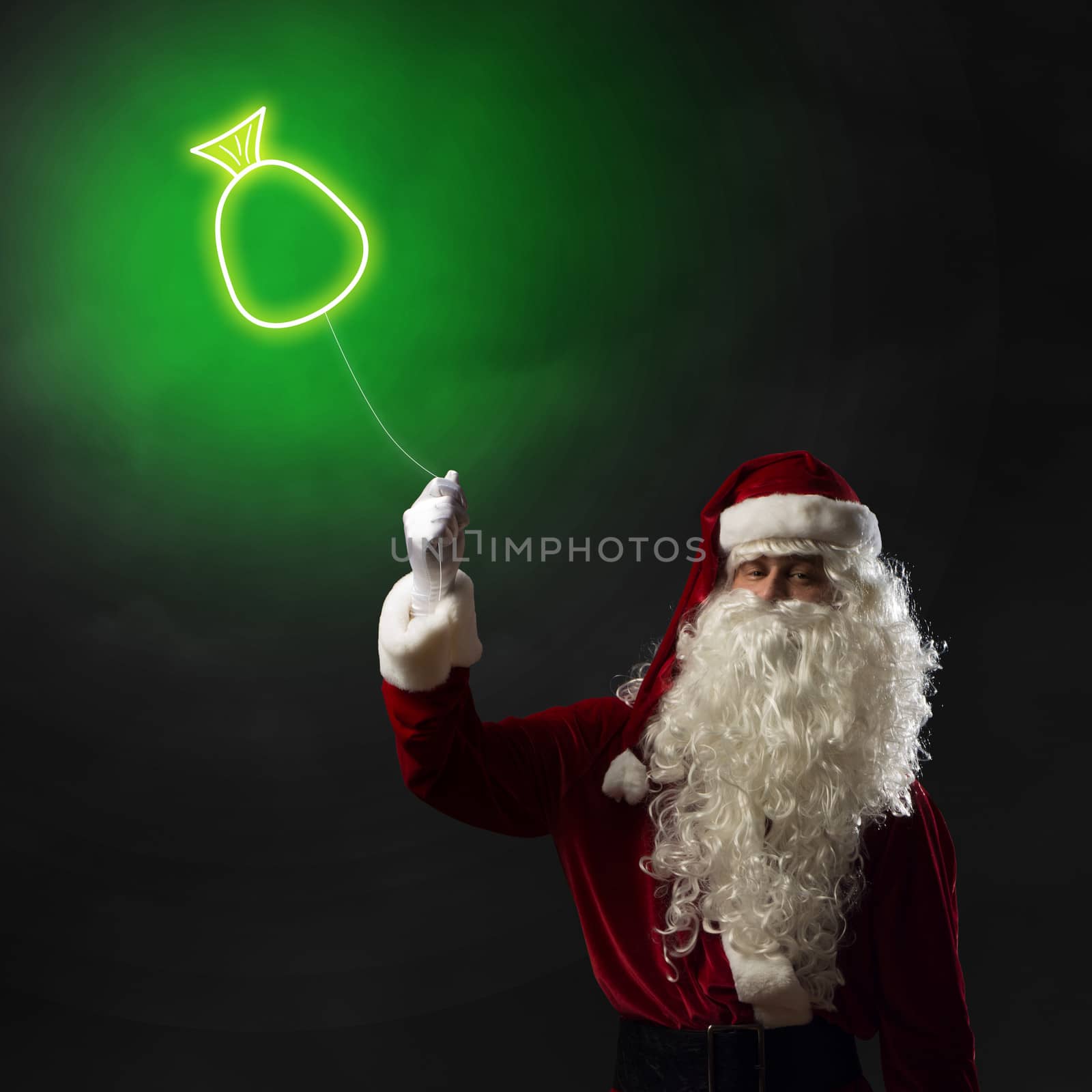 Santa Claus holding a shining light symbol of the Christmas bag for thread