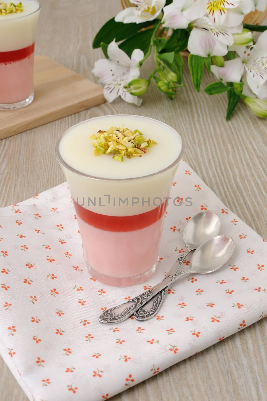 Strawberry yogurt dessert with pistachios by Apolonia