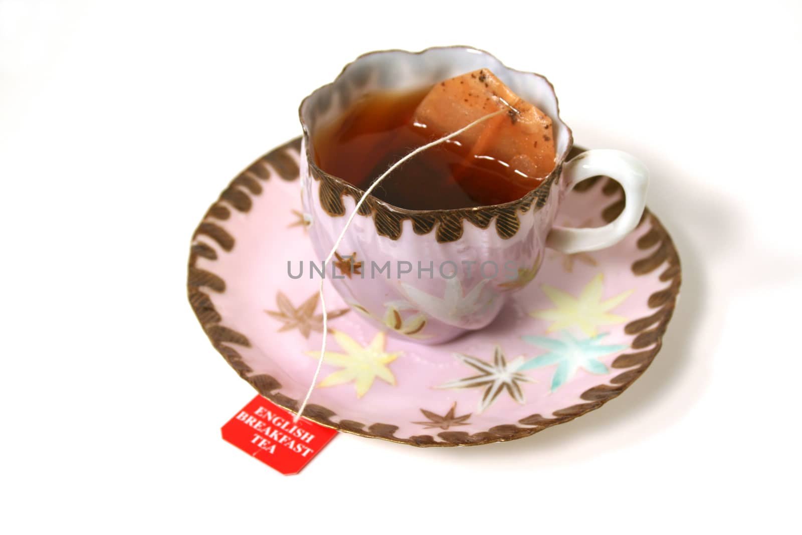 Classic antique tea cup with tea bag.