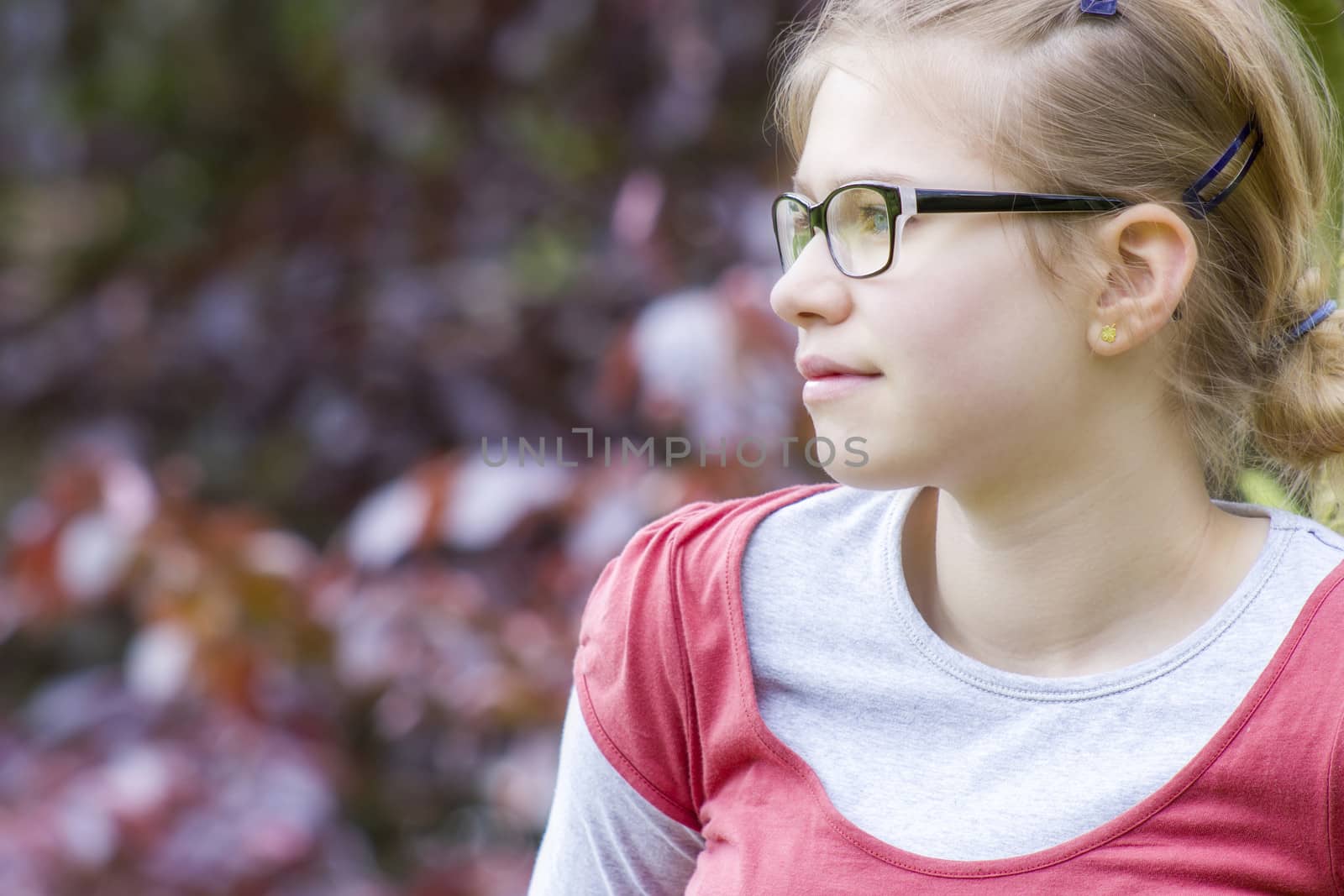 Young girl in park in spring day - portrait
