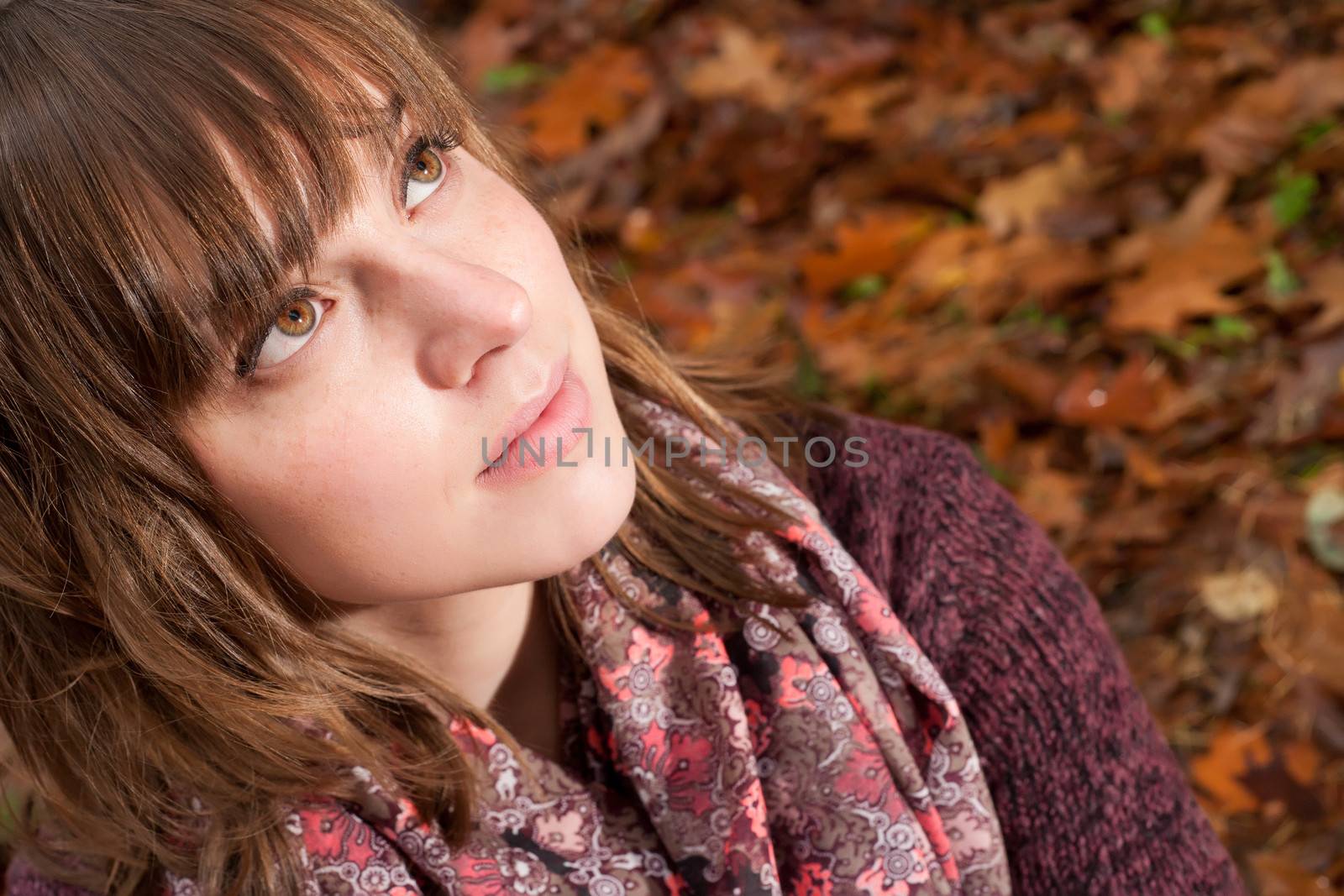 Young woman in the autumn at a cold november day