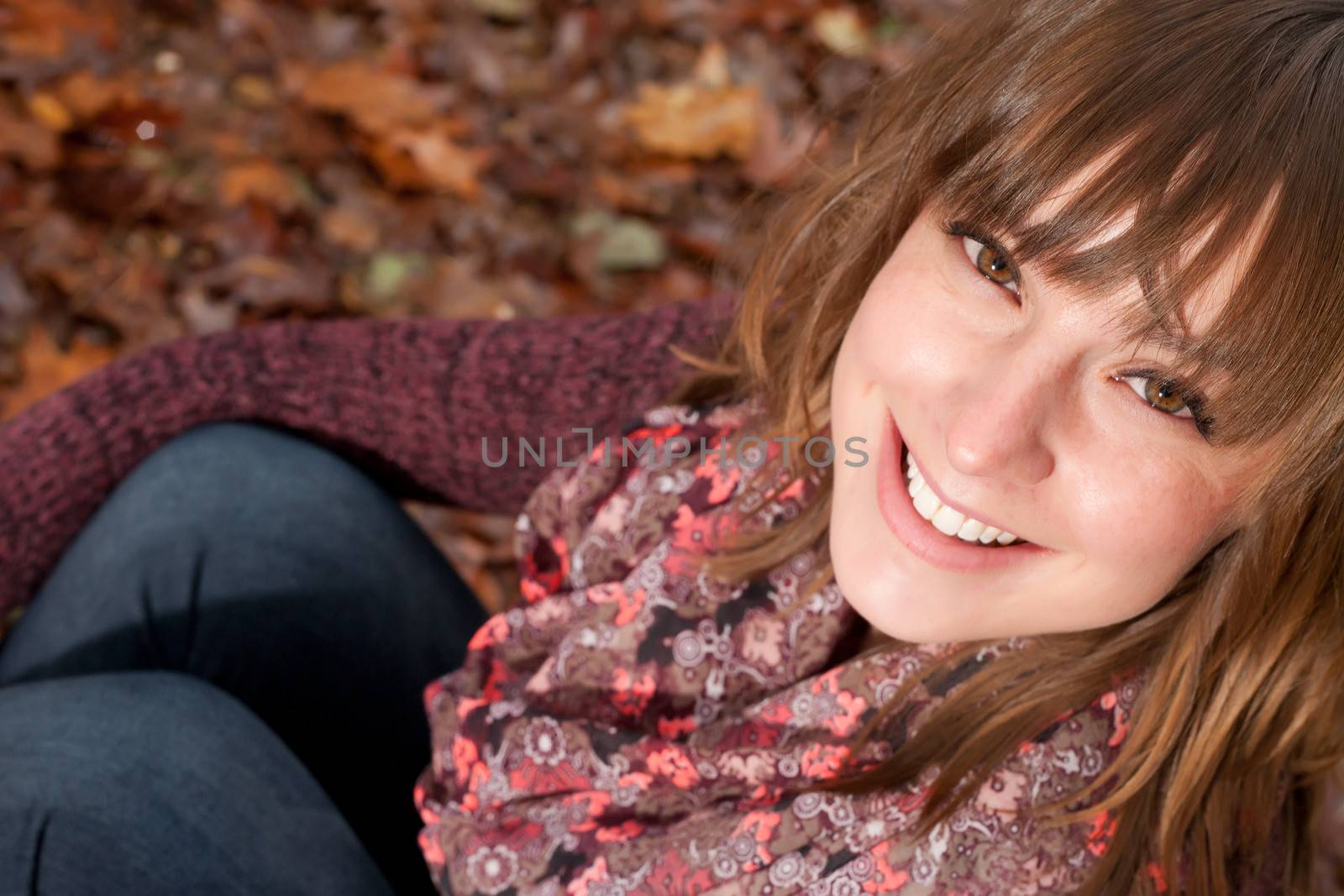 Smiling girl on the autumn ground by DNFStyle