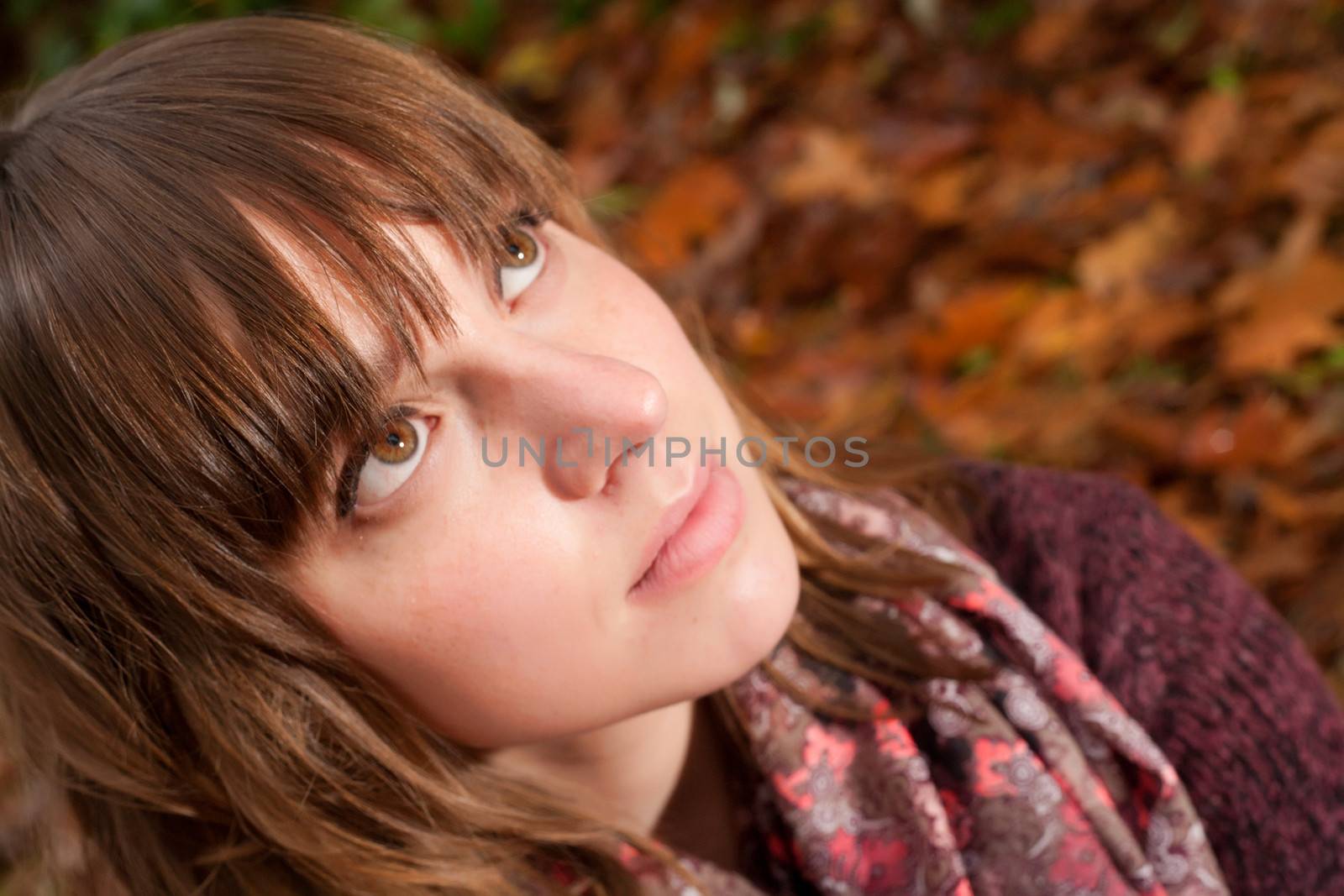 Young woman in the autumn at a cold november day