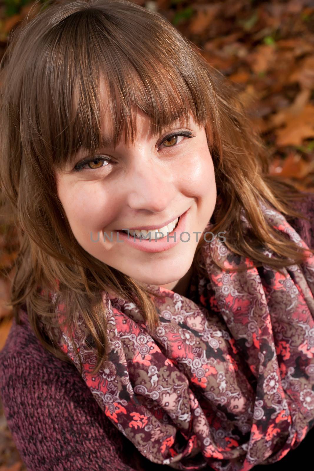 Young woman in the autumn at a cold november day