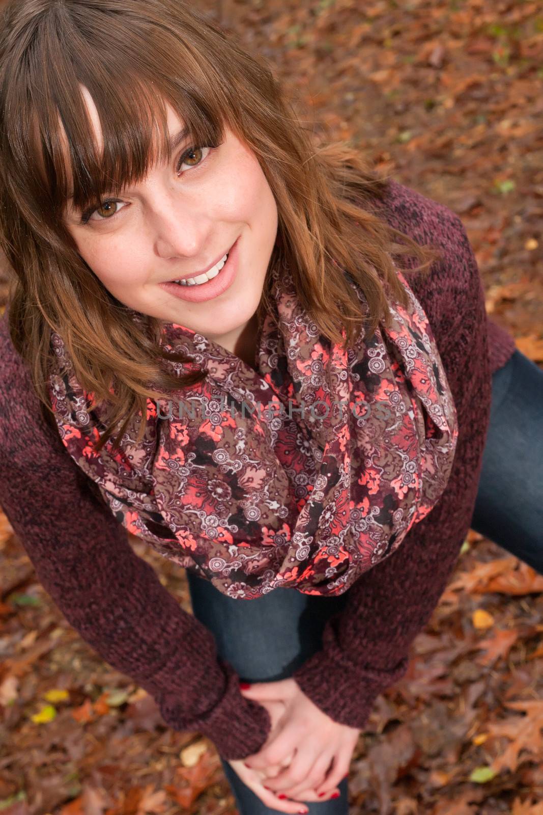 Young woman in the autumn at a cold november day