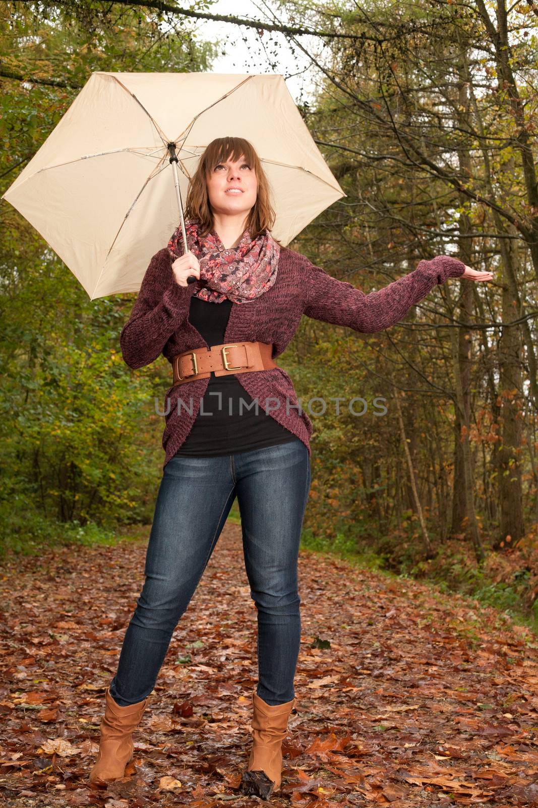 Young woman in the autumn at a cold november day