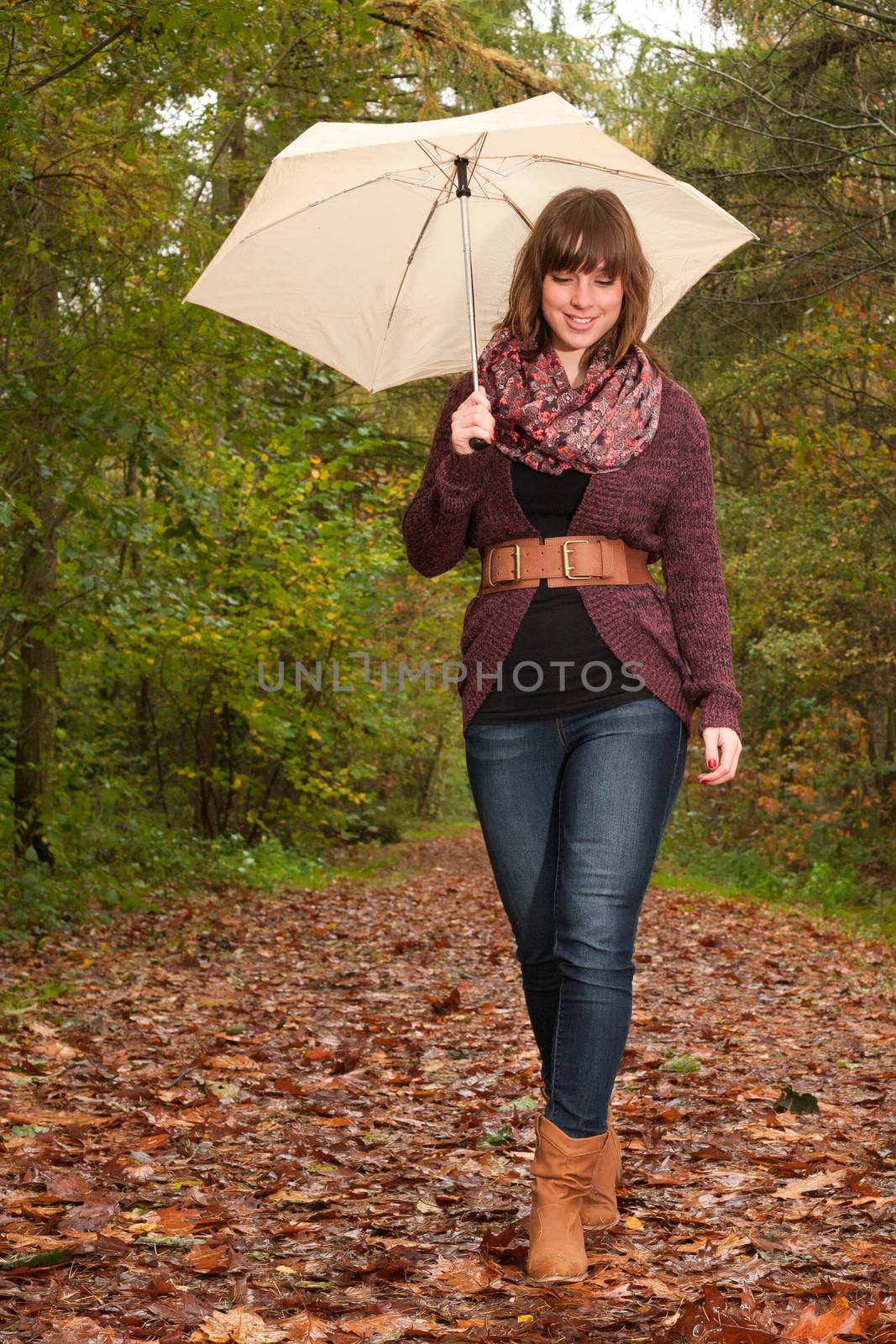 Young woman in the autumn at a cold november day